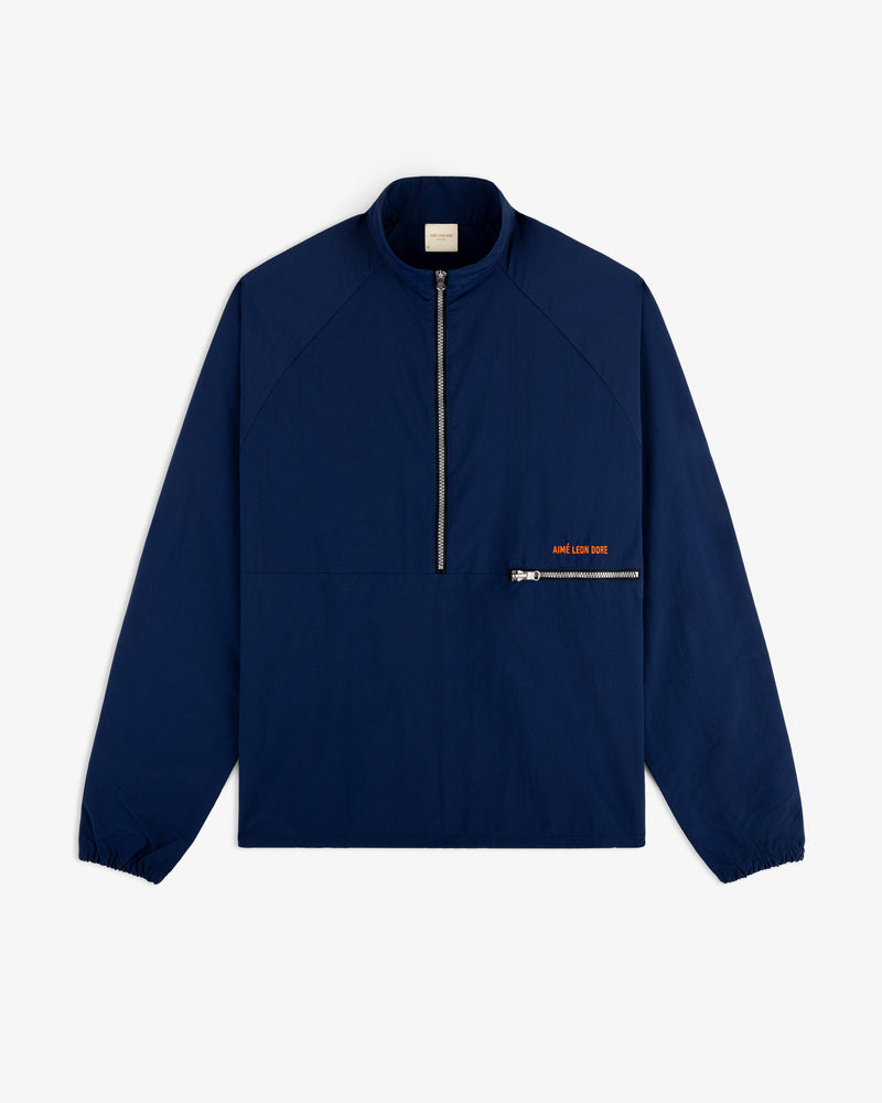 A navy Nylon Packable Windbreaker with a half-zip front, zip chest pocket, and small orange text.