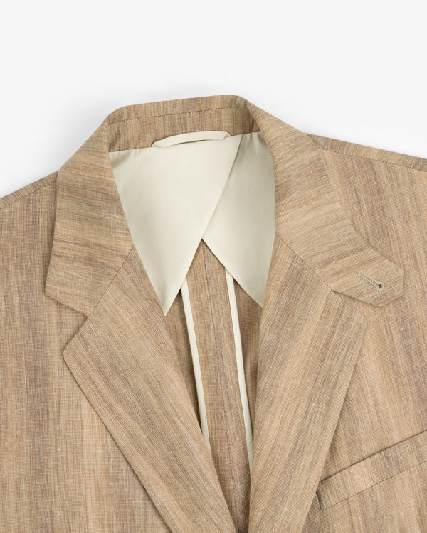 Single-Breasted Safari Suit Jacket in light brown linen, paired with a cream wide-collar shirt, shown from shoulders up.