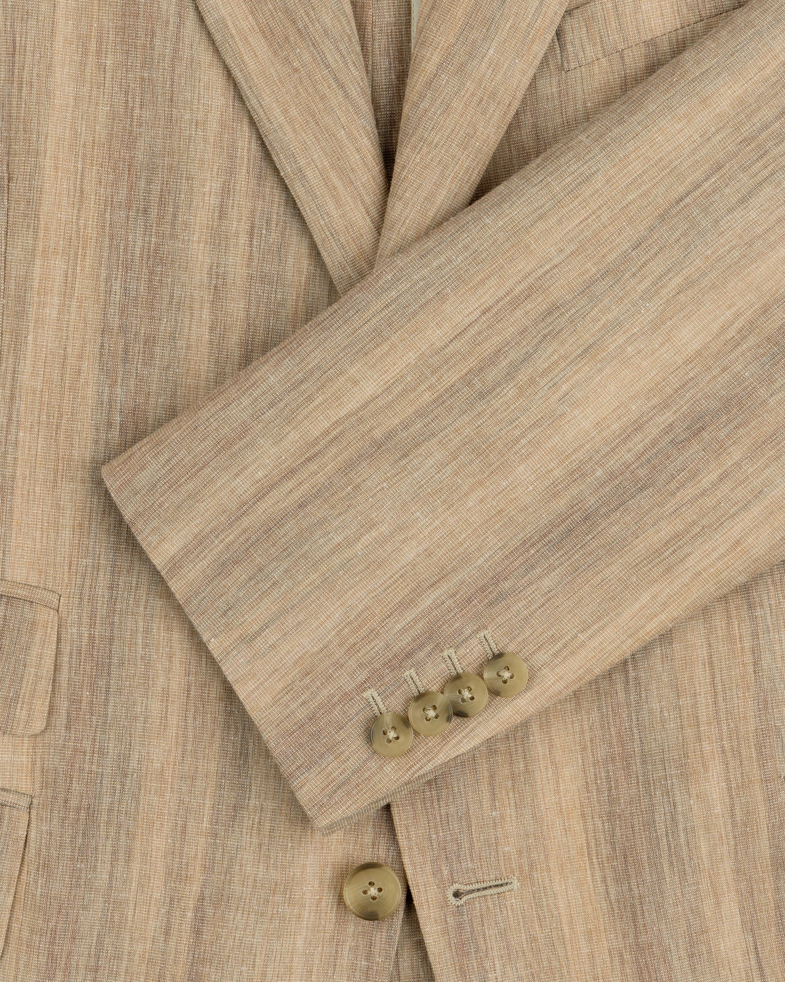 Close-up of a Single-Breasted Safari Suit Jacket sleeve in beige linen with four tan buttons and a visible pocket.