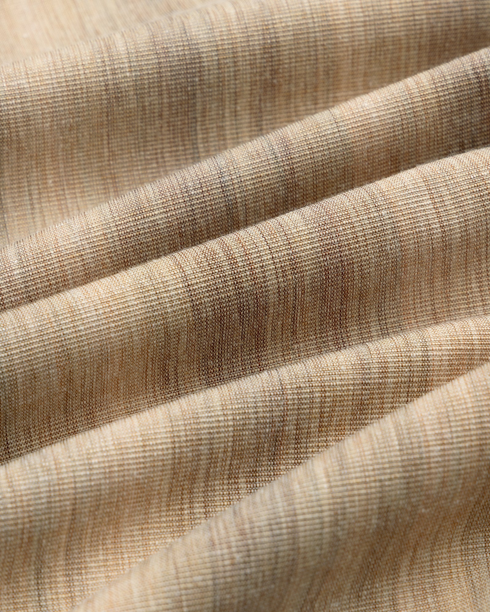 Close-up of a Single-Breasted Safari Suit Jacket in beige and brown stripes, showing soft folds and woven texture.