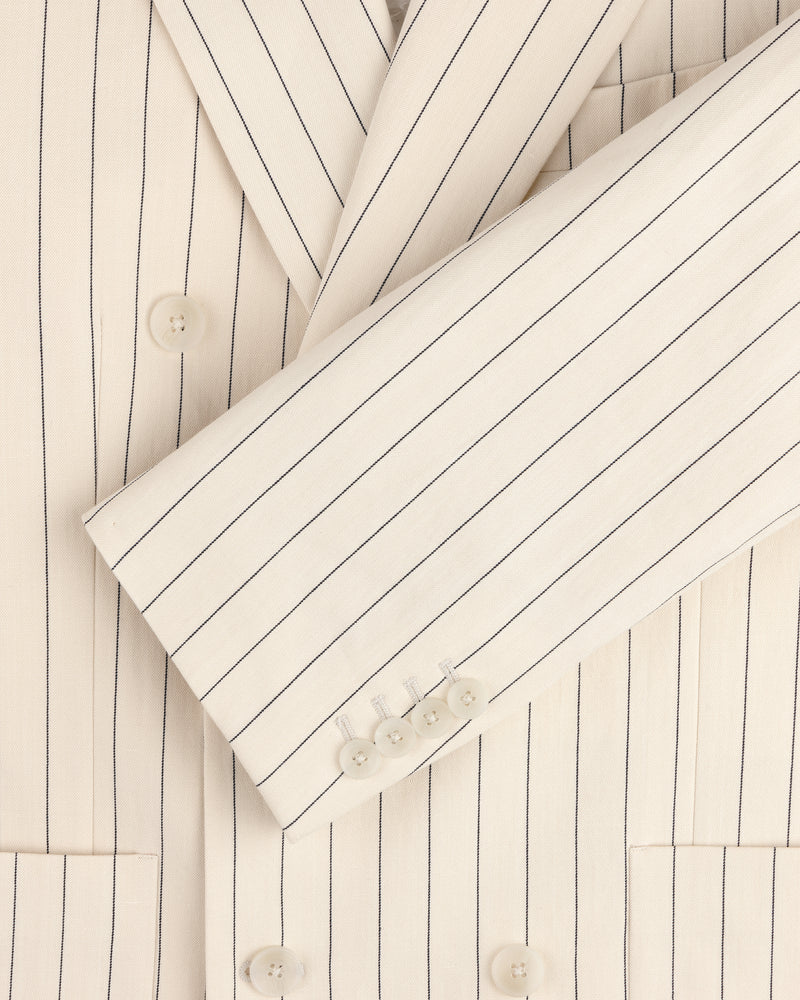 Close-up of a cream Double-Breasted Pinstripe Suit Jacket featuring buttons on the sleeve and front.