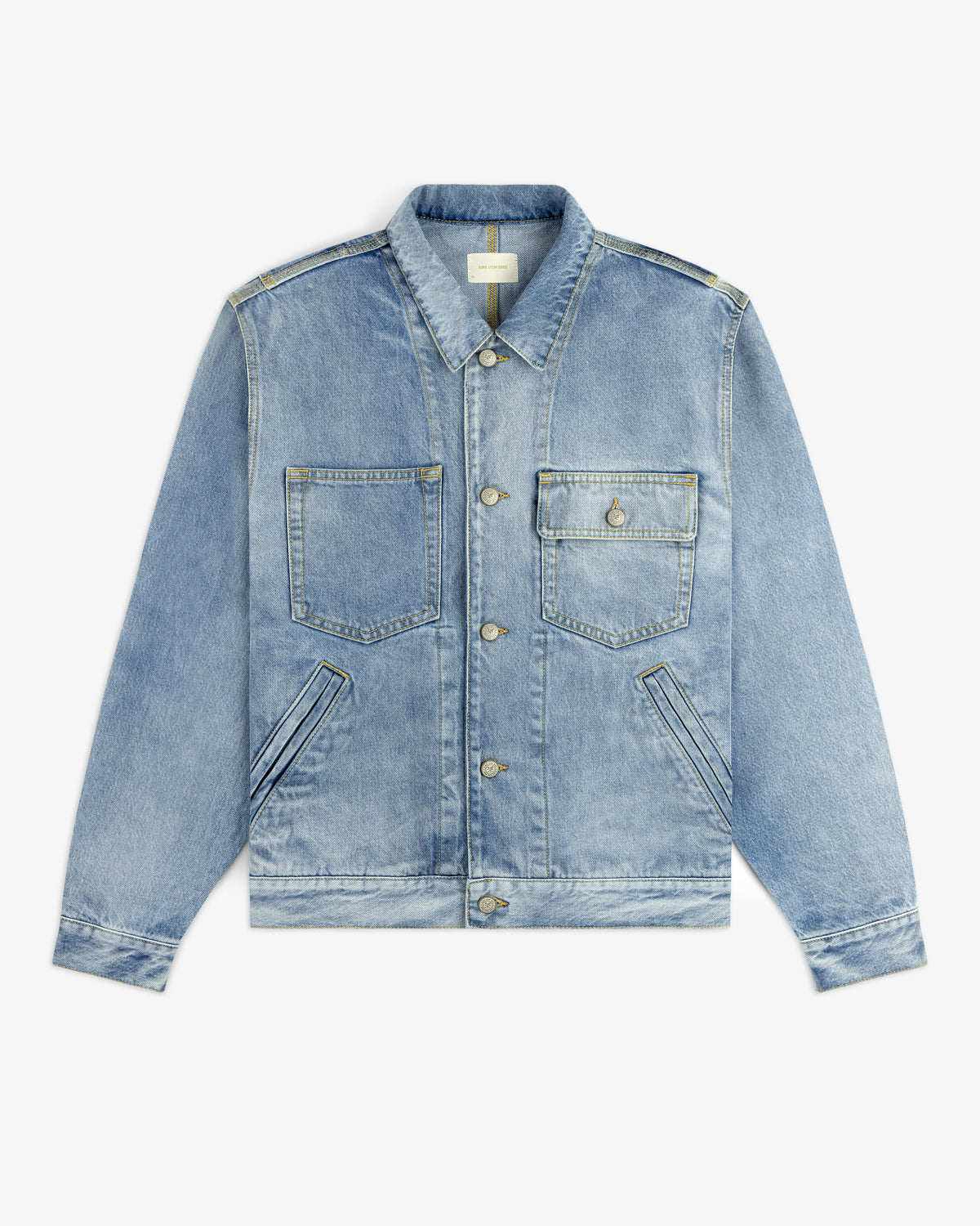 Denim Trucker Jacket in light blue with chest pockets, metal buttons, and diagonal side pockets on white background.