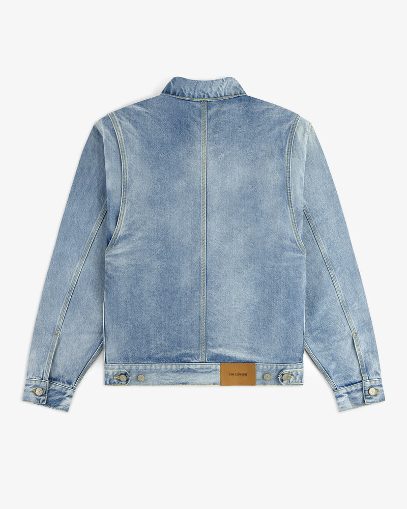 Denim Trucker Jacket in light blue, shown from the back with a brown leather patch near the waistband.