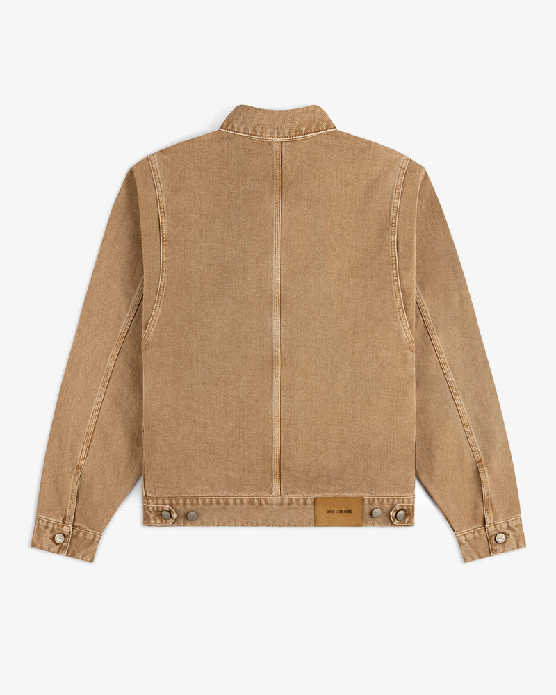 Denim Trucker Jacket in tan, shown from the back with buttoned cuffs and a brown patch near the waistband.