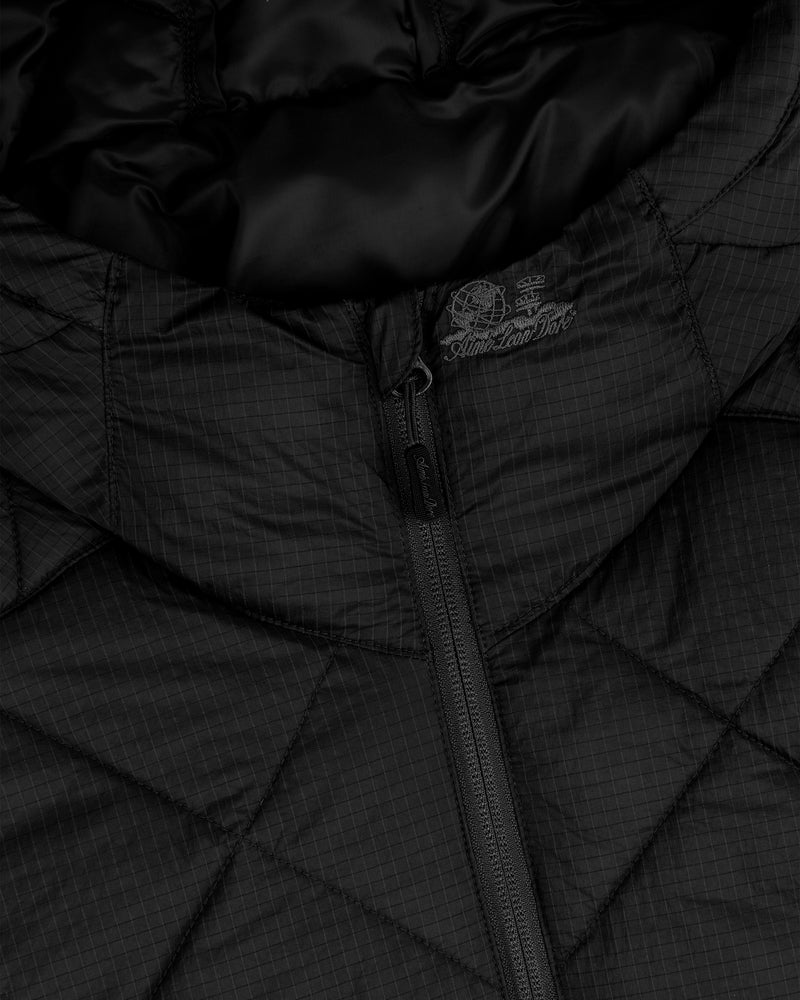 Close-up of the Nylon Quilted Unisphere Jacket in black, featuring a visible zipper and subtle collar text.