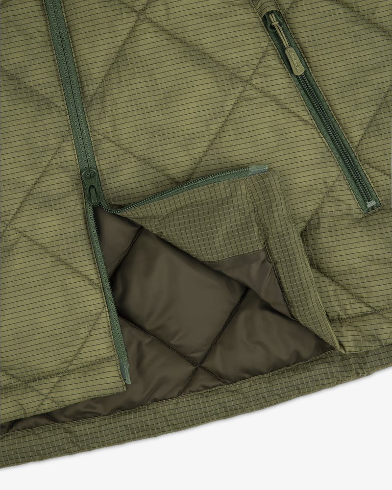 Close-up of the Nylon Quilted Unisphere Jacket in olive green with two green zippers and a flap revealing the lining.