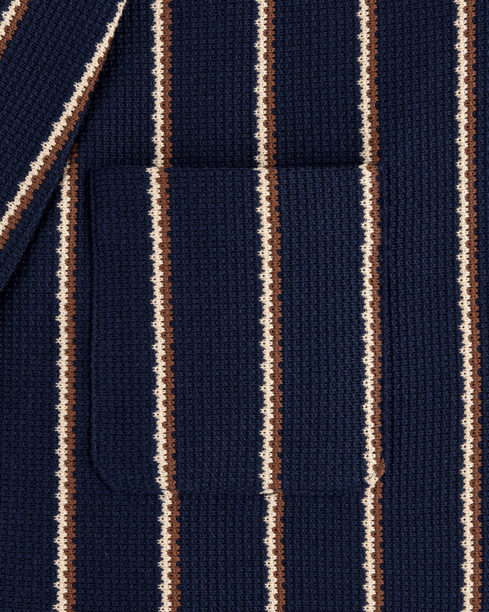 Close-up of Striped Jacquard Shawl Collar Jacket featuring vertical navy, brown, and cream stripes with a center pocket.