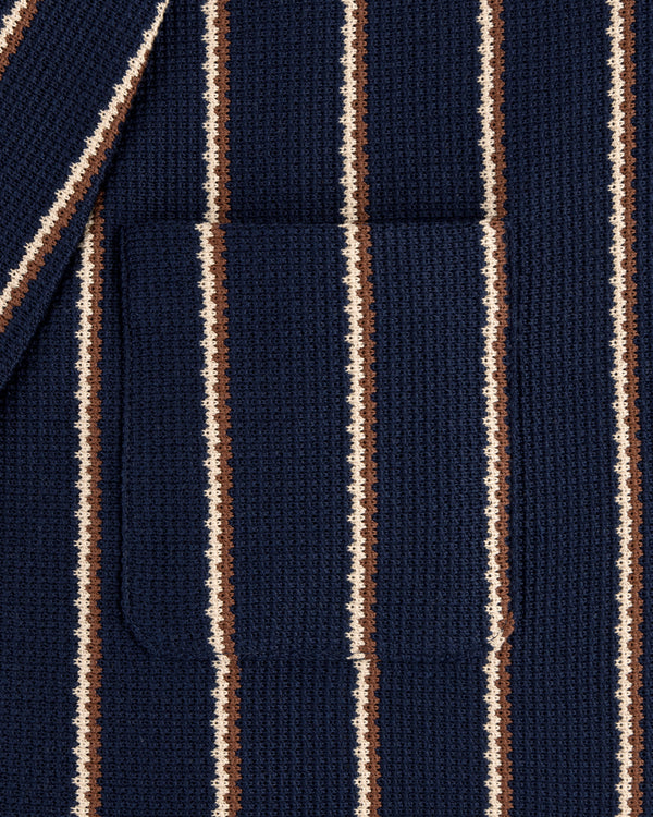 Close-up of Striped Jacquard Shawl Collar Jacket featuring vertical navy, brown, and cream stripes with a center pocket.