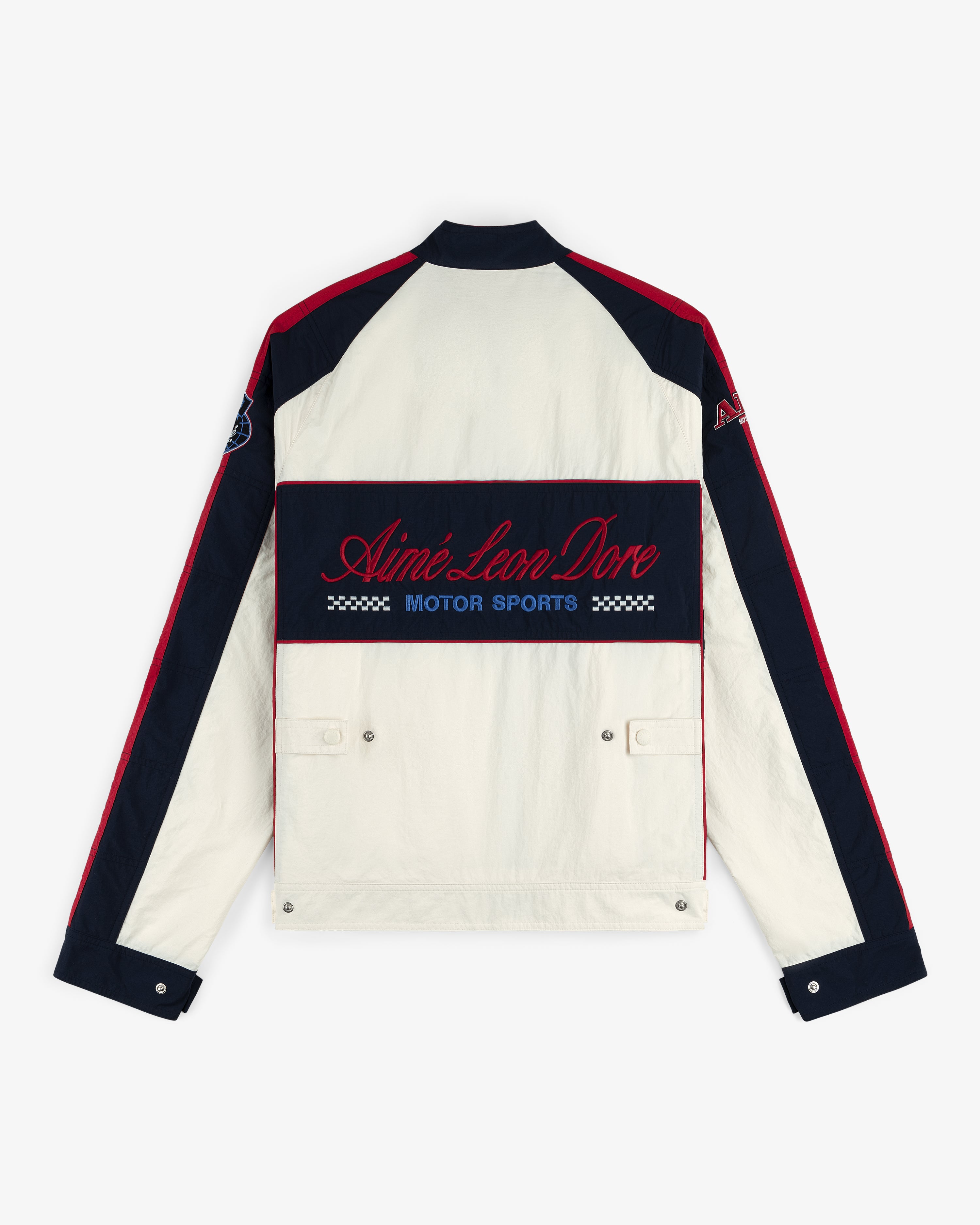 Back view of the Nylon Moto Jacket in cream and navy with red accents, Aimé Leon Dore Motor Sports on the back.