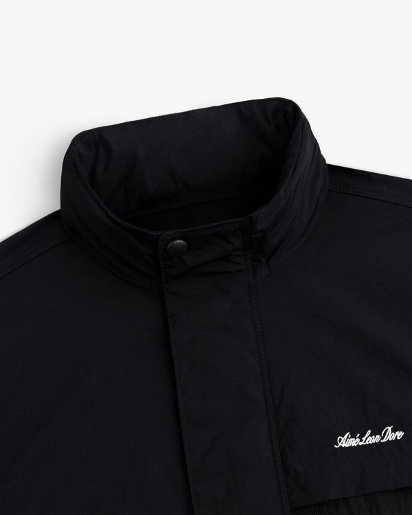 Nylon Track Jacket with high collar and snap button, “Aimé Leon Dore” embroidered in white on the chest.