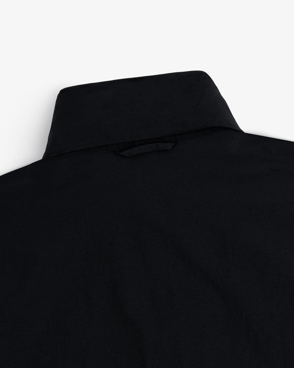 Close-up of the back of a Nylon Track Jacket, highlighting the collar and upper back fabric on a white background.
