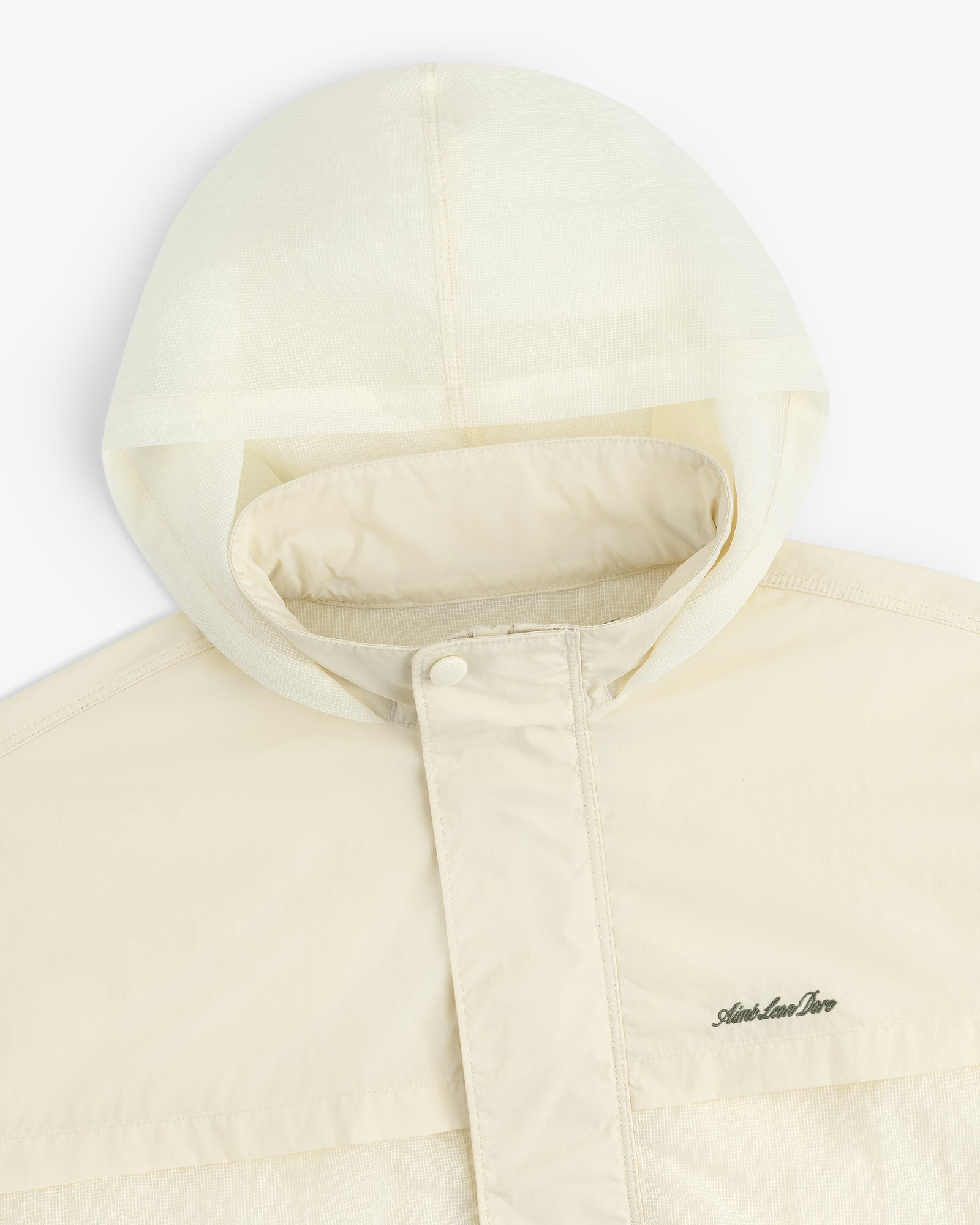 Cream-colored Nylon Track Jacket with a hood, snap-button placket, and Arlen Ness logo on the chest.