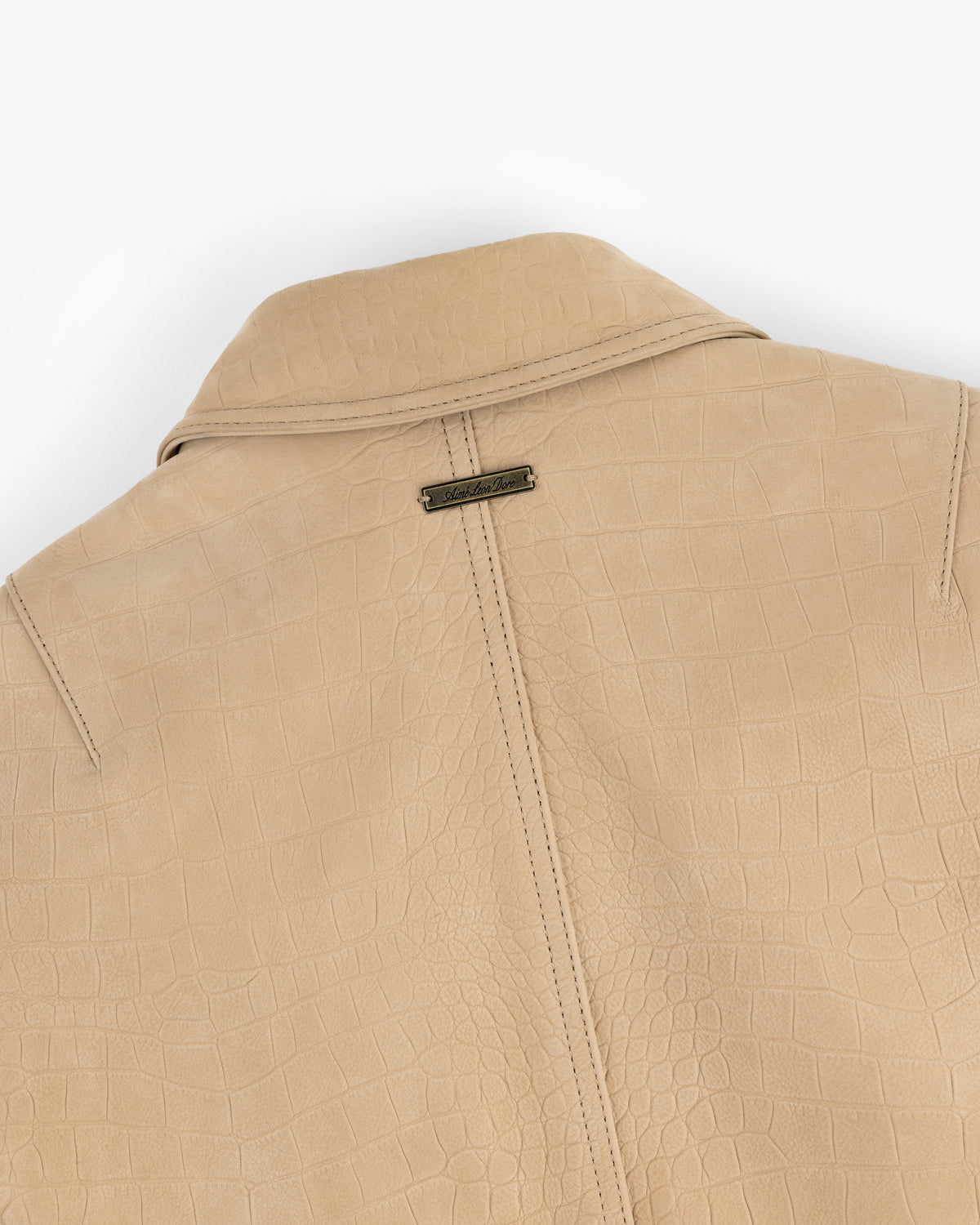 Beige Croc-Embossed Nubuck Bomber Jacket with collar and small metallic brand tag below the collar.