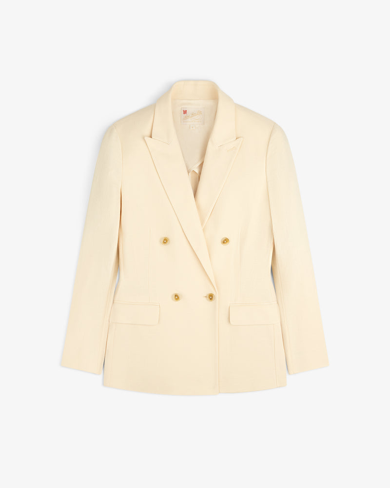 Double-Breasted Unconstructed Blazer in cream with notched lapels and gold buttons, shown on a white background.