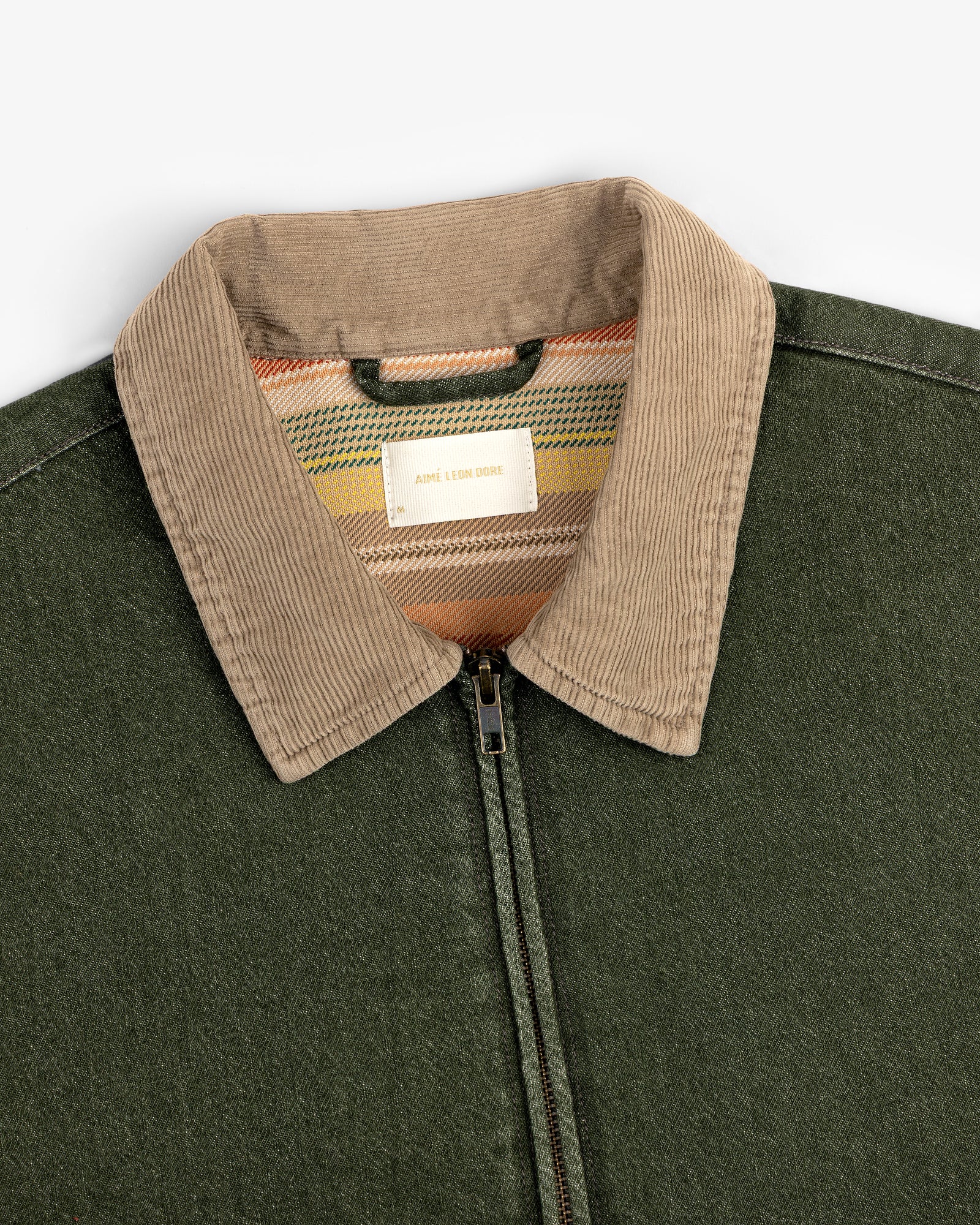 Denim Zip Jacket with tan corduroy collar and striped inner label, displayed on a white background.