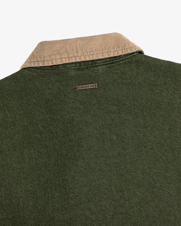 Close-up of the back of a green Denim Zip Jacket with a beige collar and a small metal Jamie Leake logo tag.