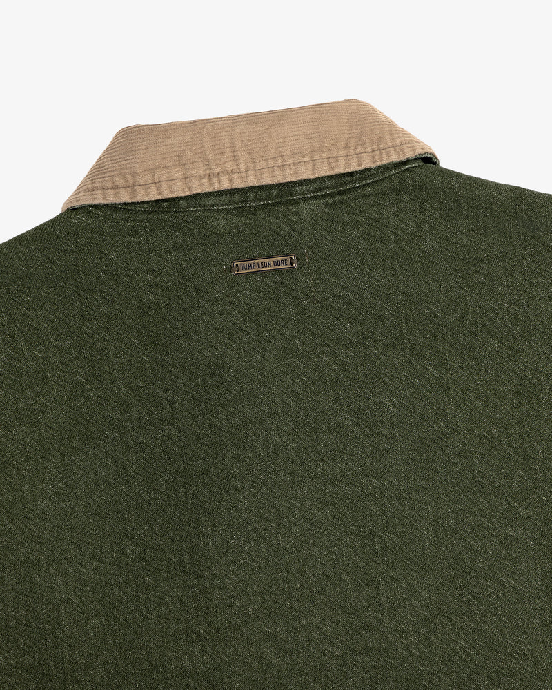 Close-up of the back of a green Denim Zip Jacket with a beige collar and a small metal Jamie Leake logo tag.