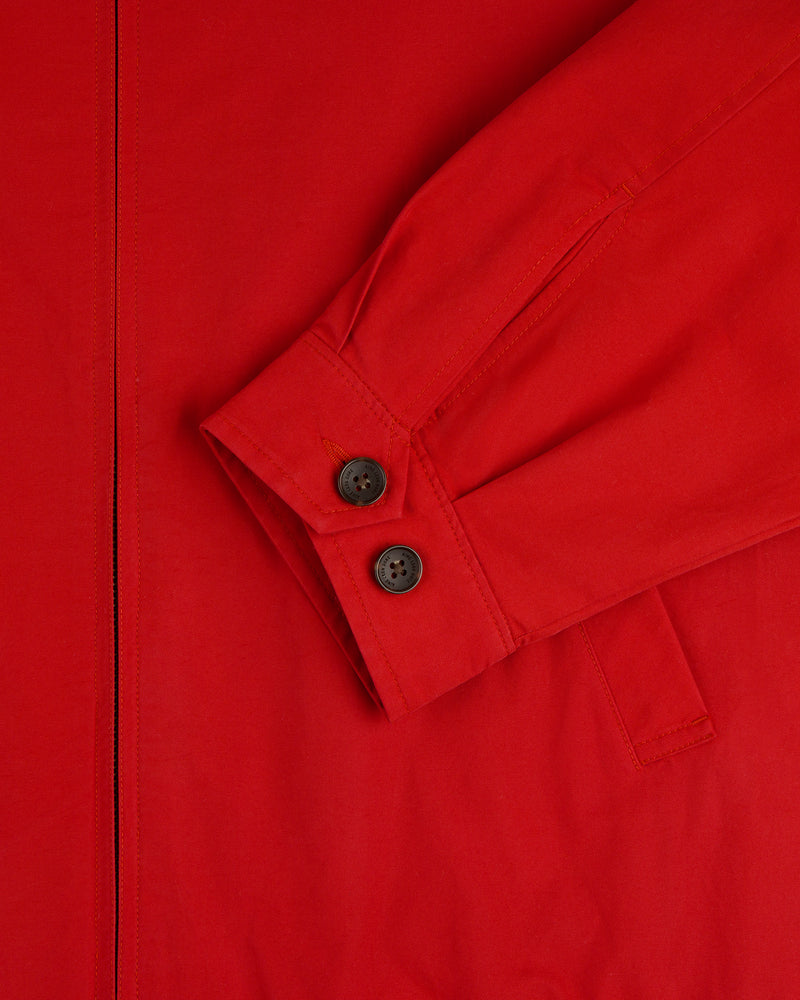Close-up of a Crest Casual Jacket’s red sleeve cuff with two black buttons and part of the pocket visible.