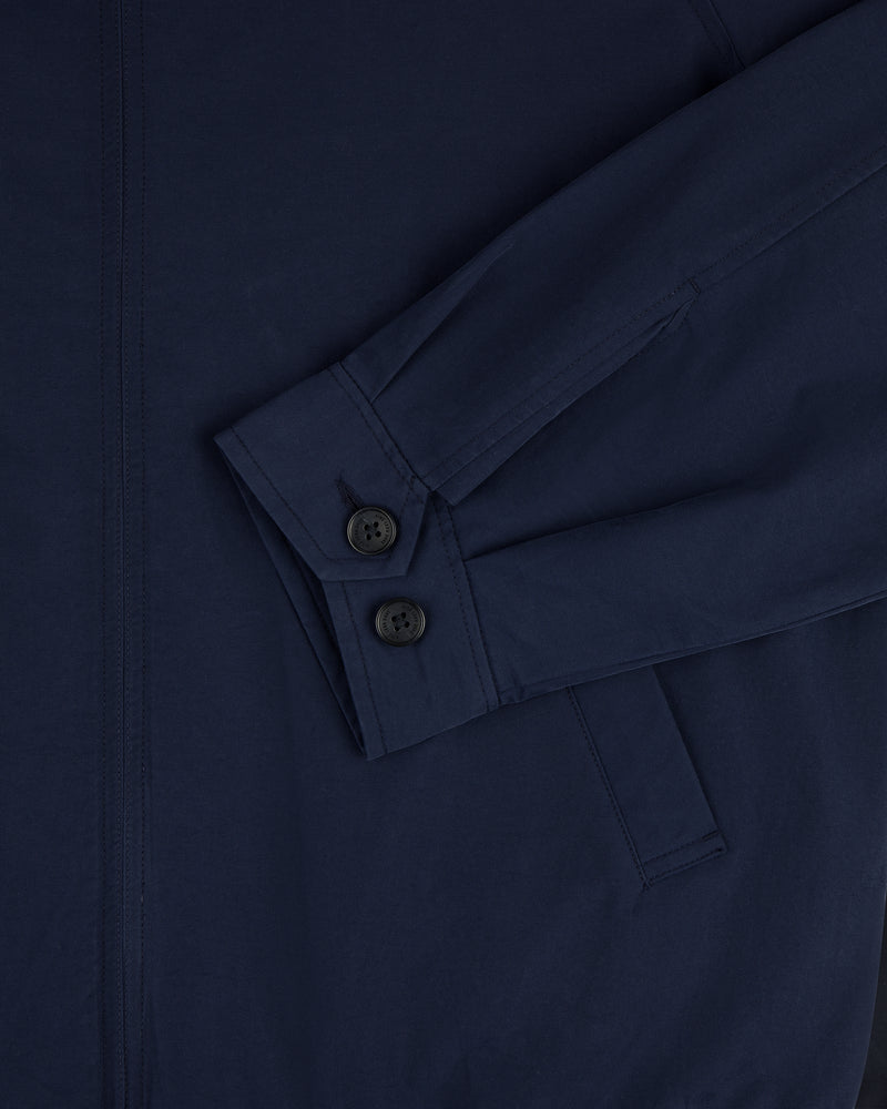 Close-up of the Crest Casual Jacket sleeve in navy blue, showing two black buttons and part of a pocket.