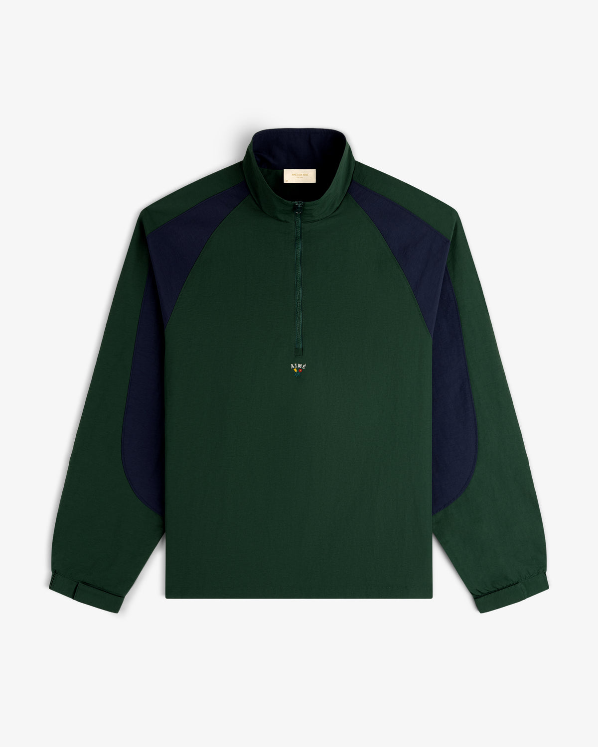 Crest Nylon Half-Zip Pullover in dark green with navy panels, zip collar, shown flat on a white background.