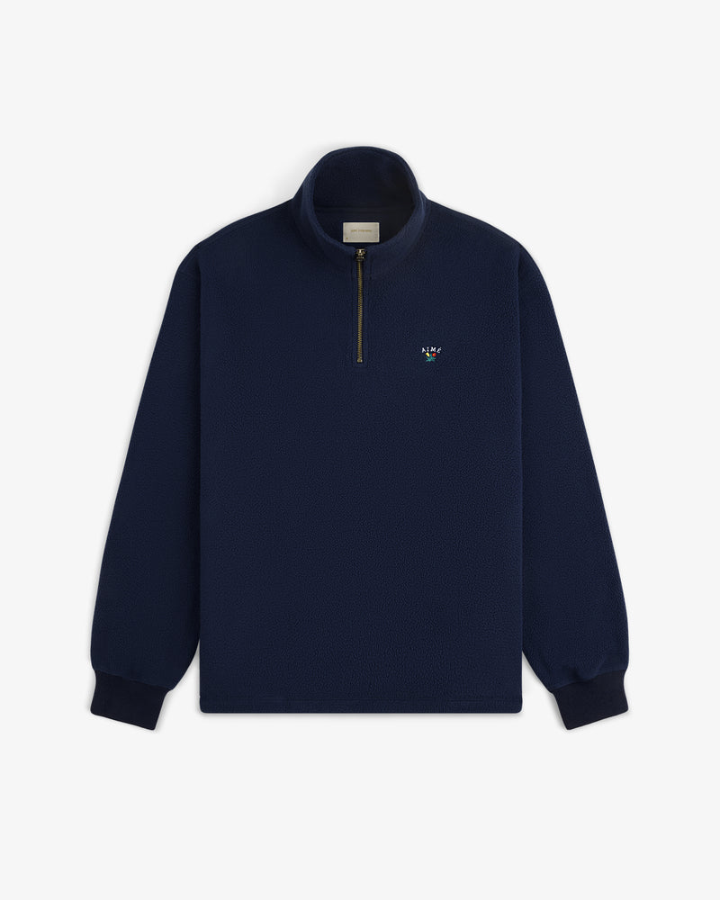 Crest Quarter-Zip Fleece Pullover in navy blue with a half-zip front and small left chest embroidered logo.