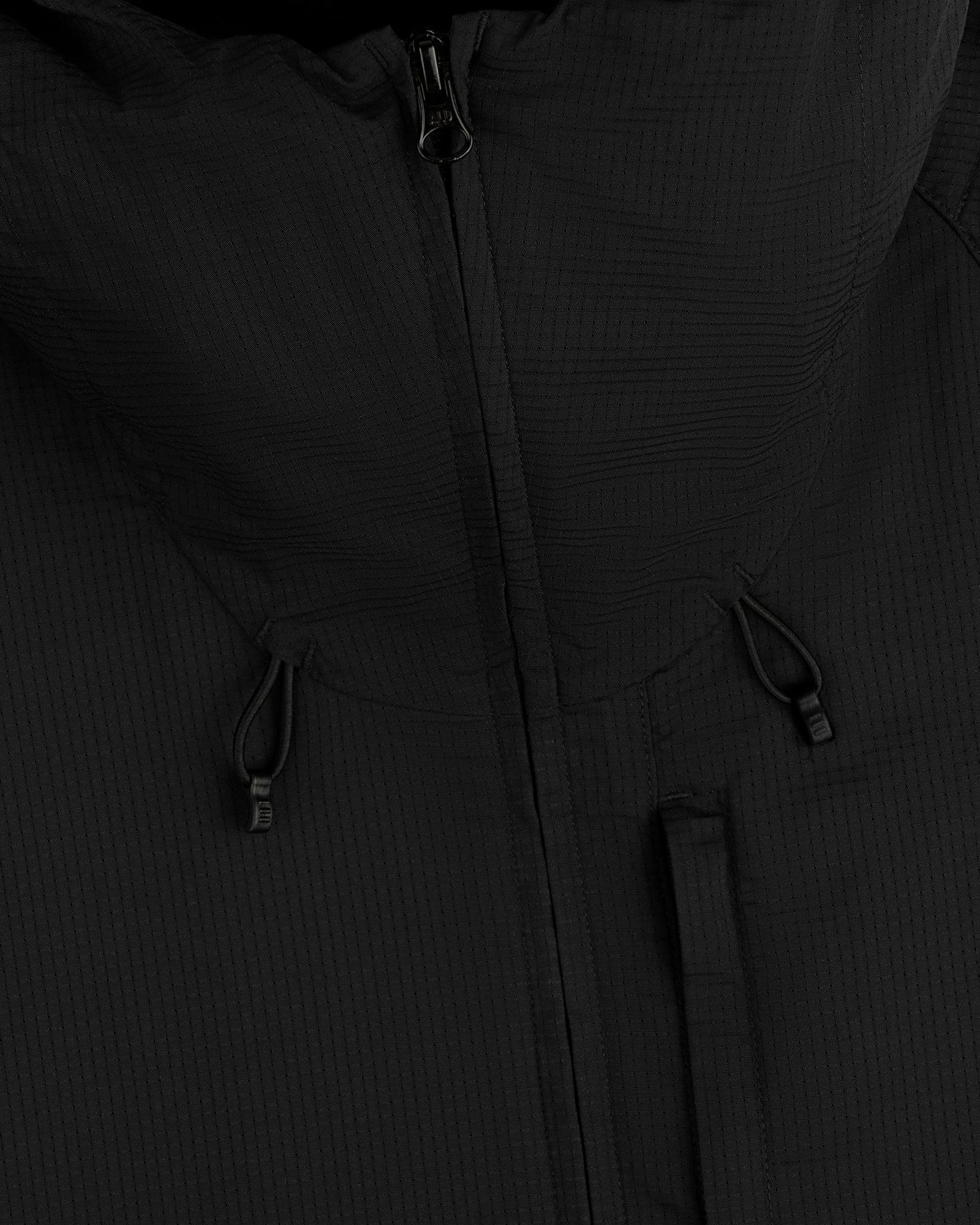 Close-up of the ALD Golf Lightweight Tips Windbreaker in black, featuring a zipper, hood, and adjustable drawstrings.