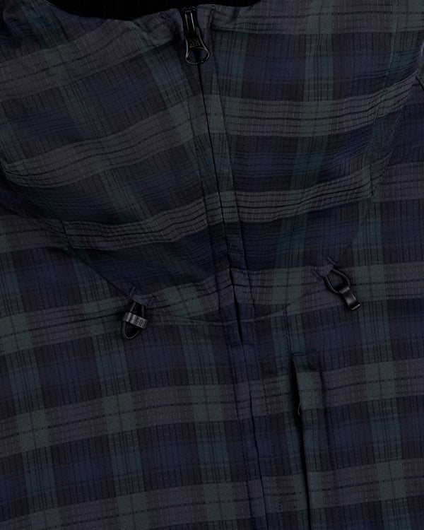 Close-up of the ALD Golf Lightweight Tips Windbreaker, featuring a plaid pattern, zipper, and two small black loops.