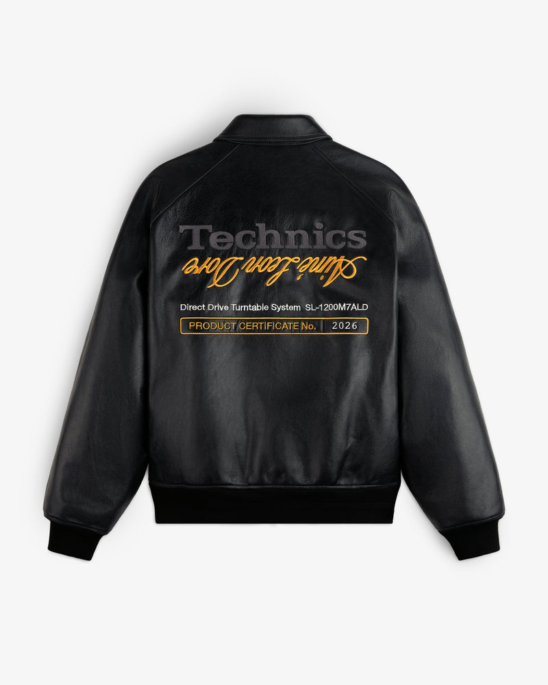 ALD / Technics Varsity Leather Jacket: Black leather with gold script and PRODUCT CERTIFICATE No. 2026 label.