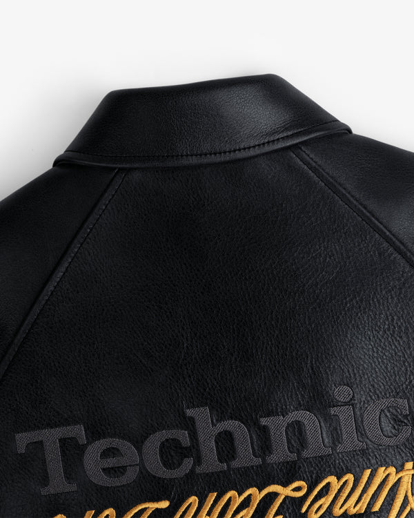ALD / Technics Varsity Leather Jacket with black and gold Technics embroidery on back near the collar.