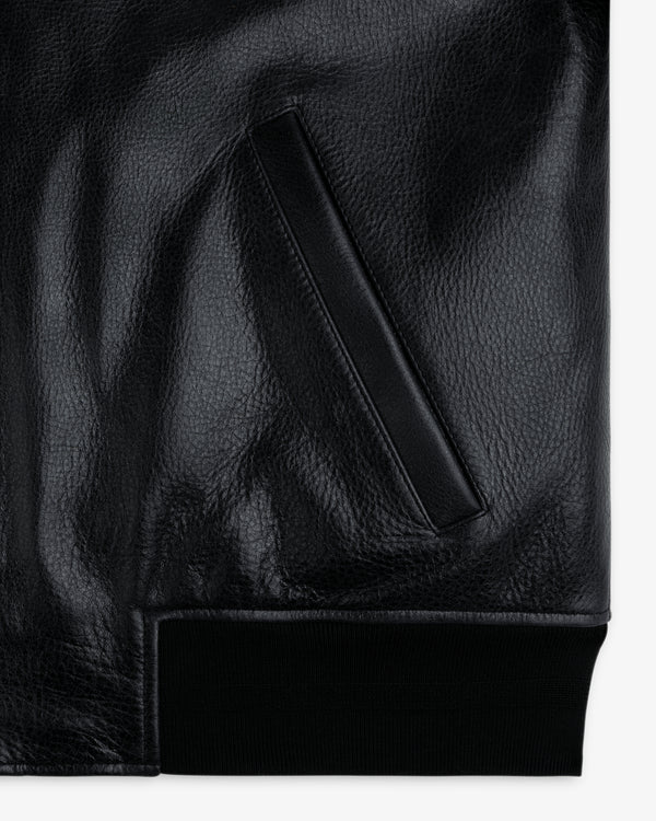 Close-up of ALD / Technics Varsity Leather Jacket pocket with ribbed hem at the bottom.