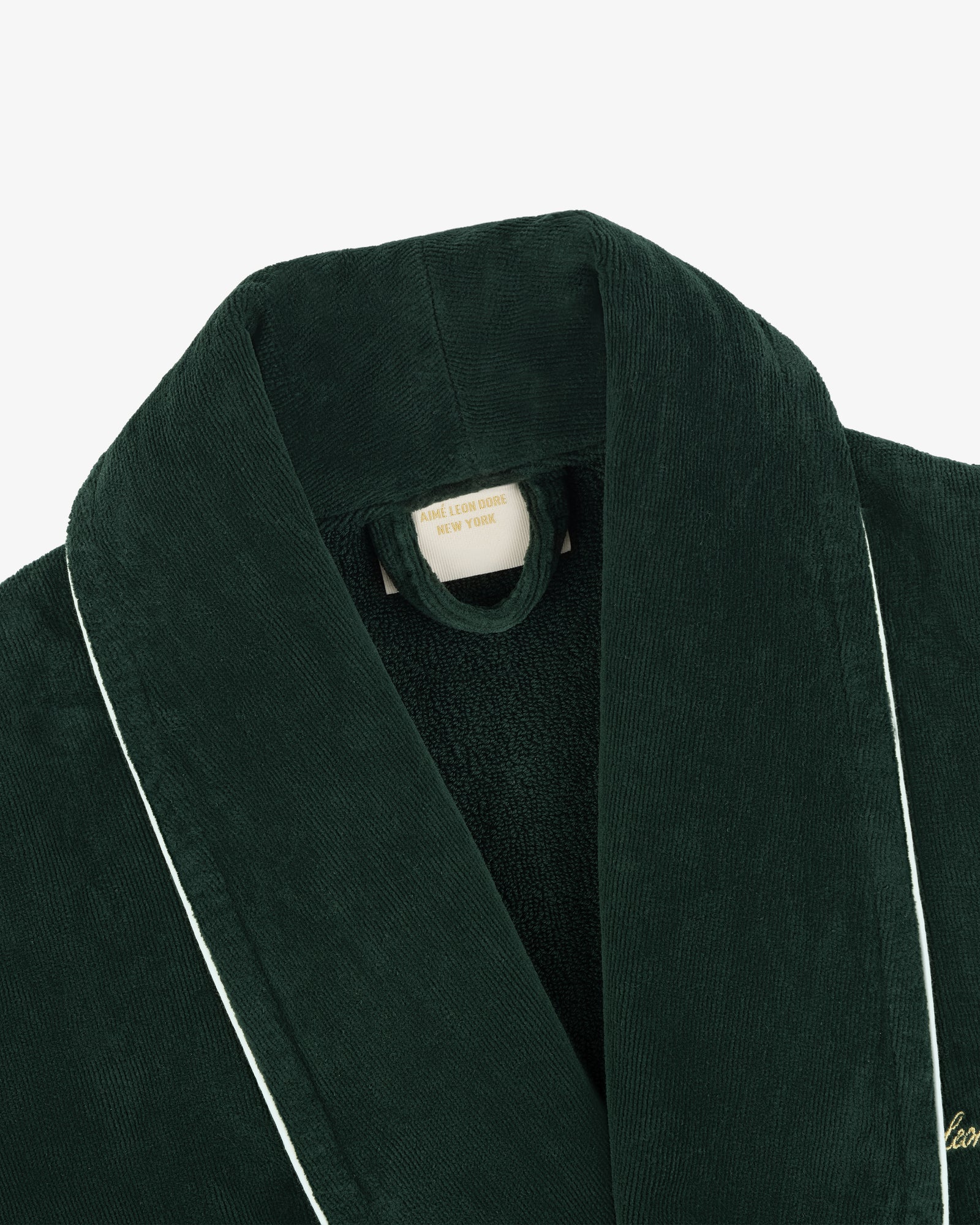 Mulberry Robe: Dark green corduroy with white piping, featuring a visible label inside the collar.