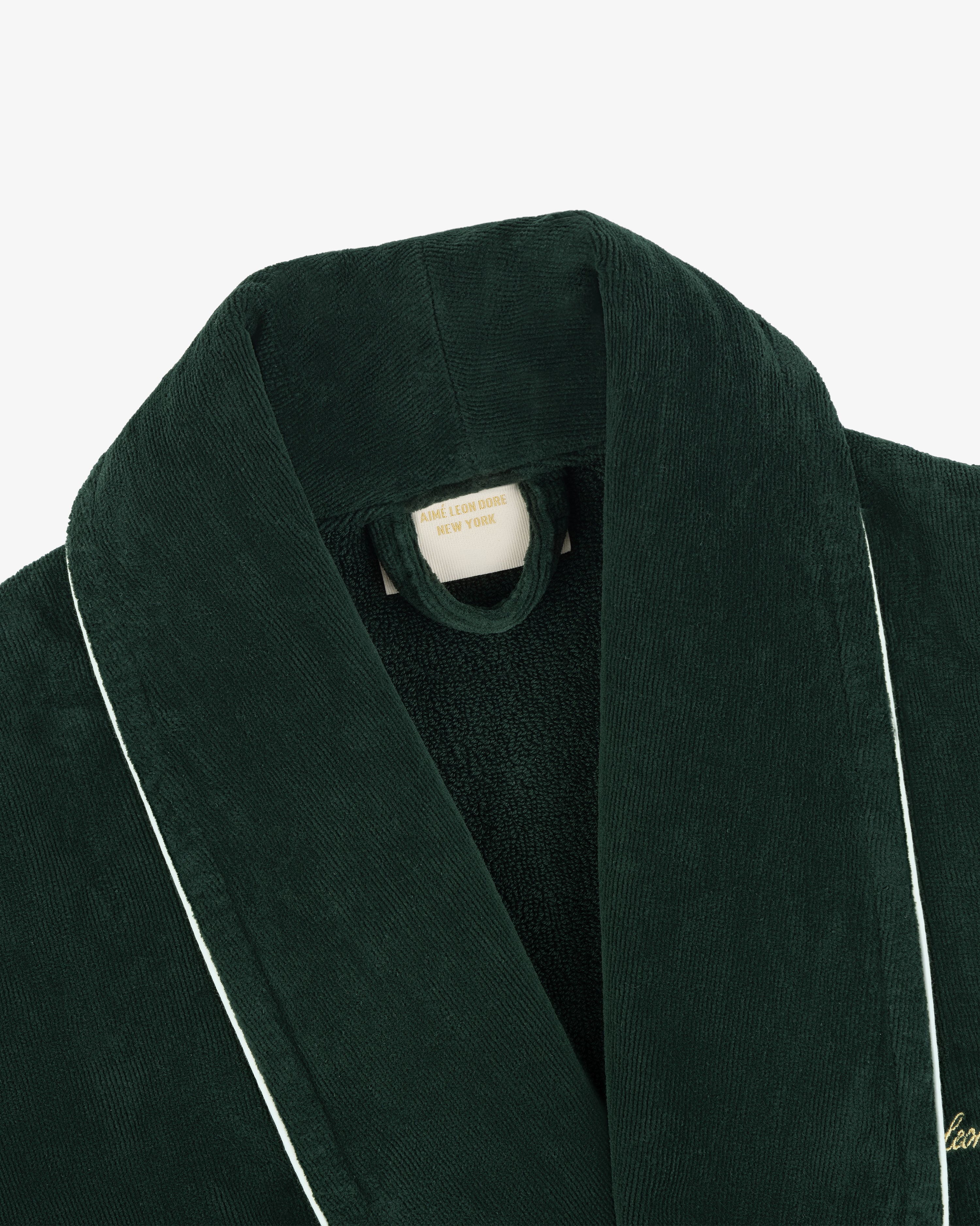 Mulberry Robe: Dark green corduroy with white piping, featuring a visible label inside the collar.