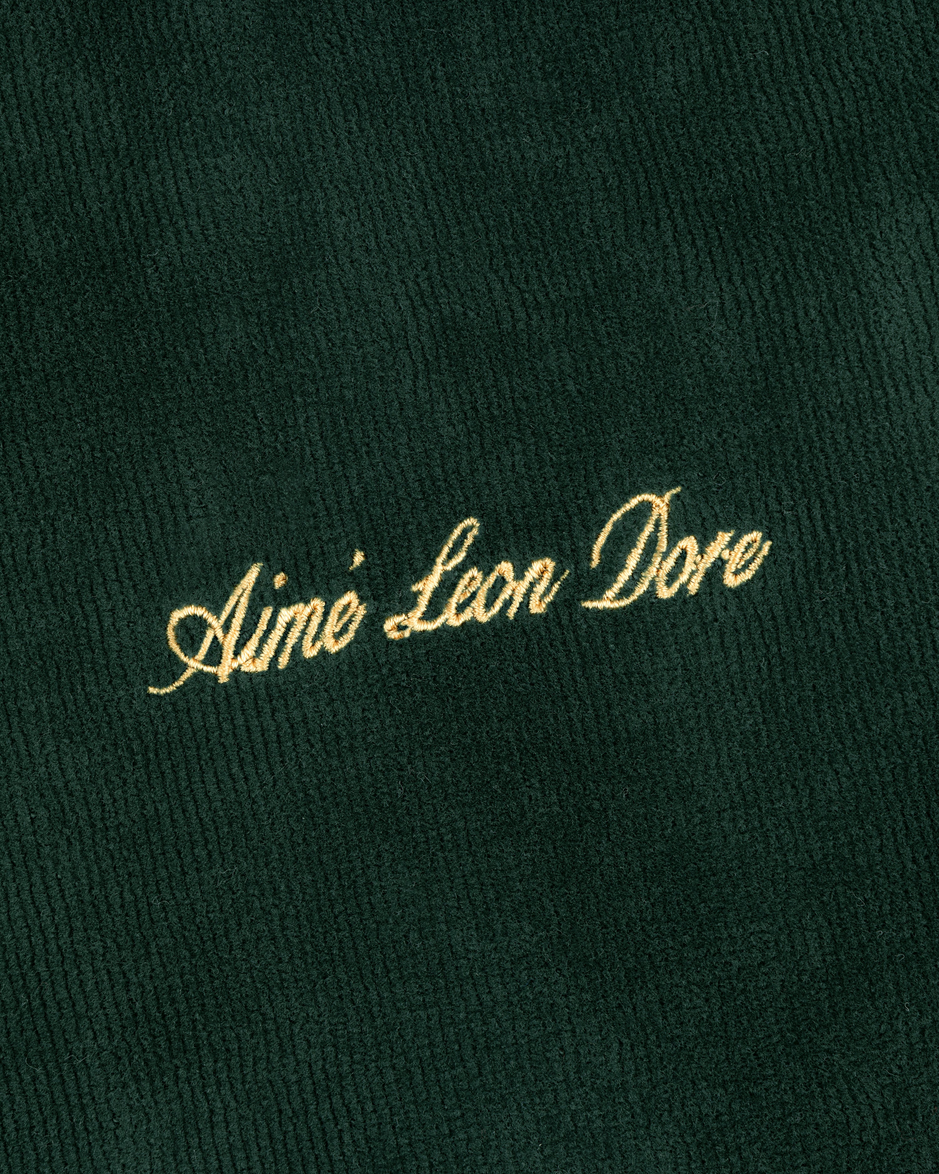 Gold Aimé Leon Dore script embroidered on dark green corduroy Mulberry Robe.