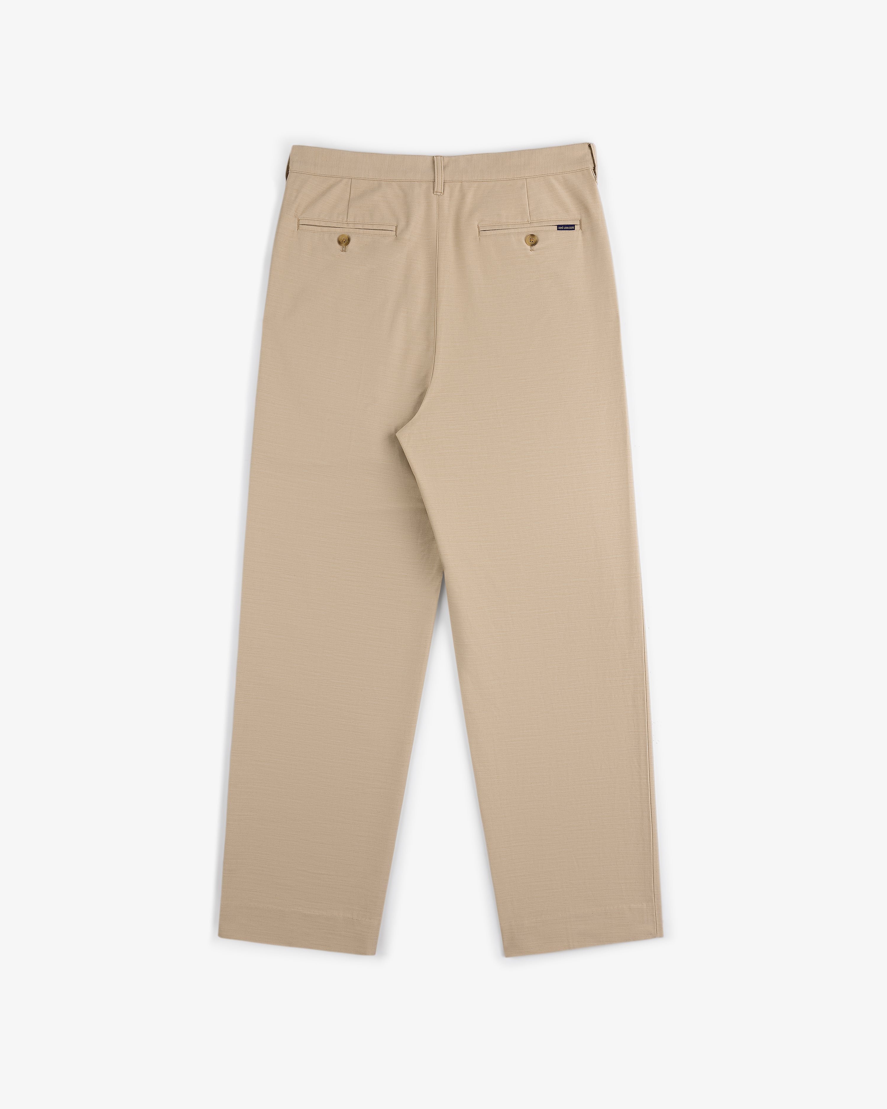 Double Pleated Pant in beige, shown from the back with two buttoned rear pockets and a straight leg cut.
