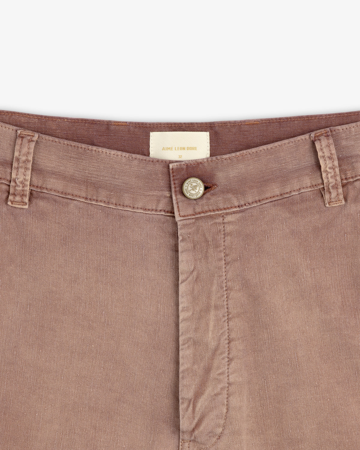 Close-up of Linen Blend Carpenter Pant waistband, featuring button closure, belt loops, and visible brand tag.
