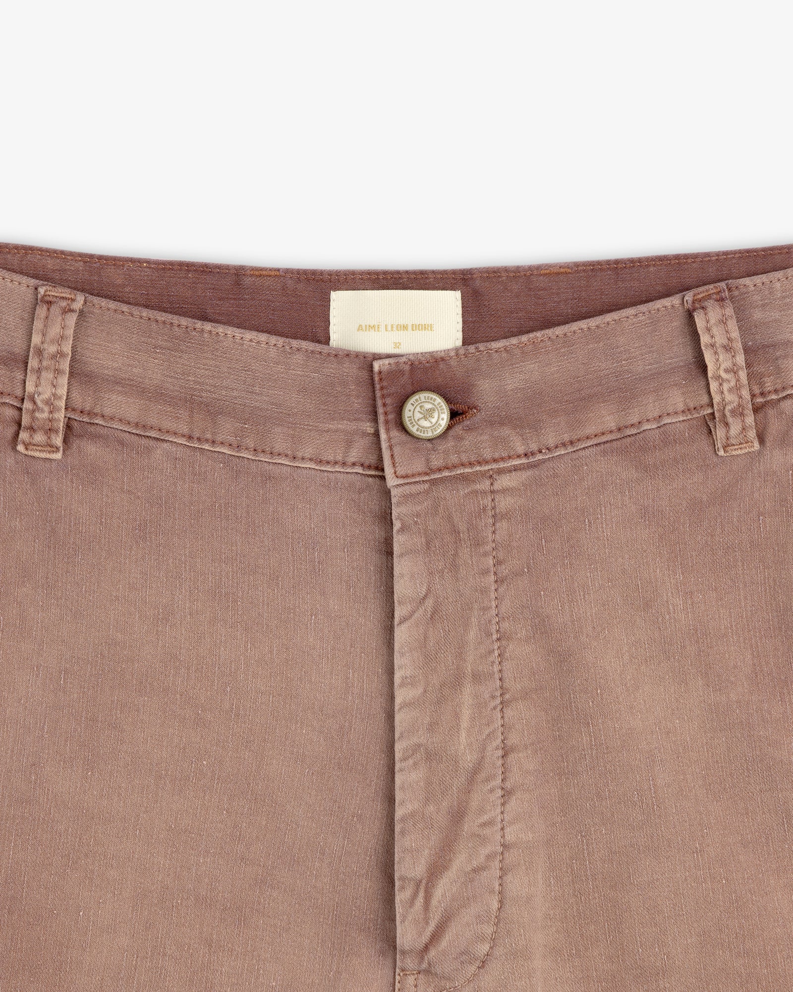 Close-up of Linen Blend Carpenter Pant waistband, featuring button closure, belt loops, and visible brand tag.