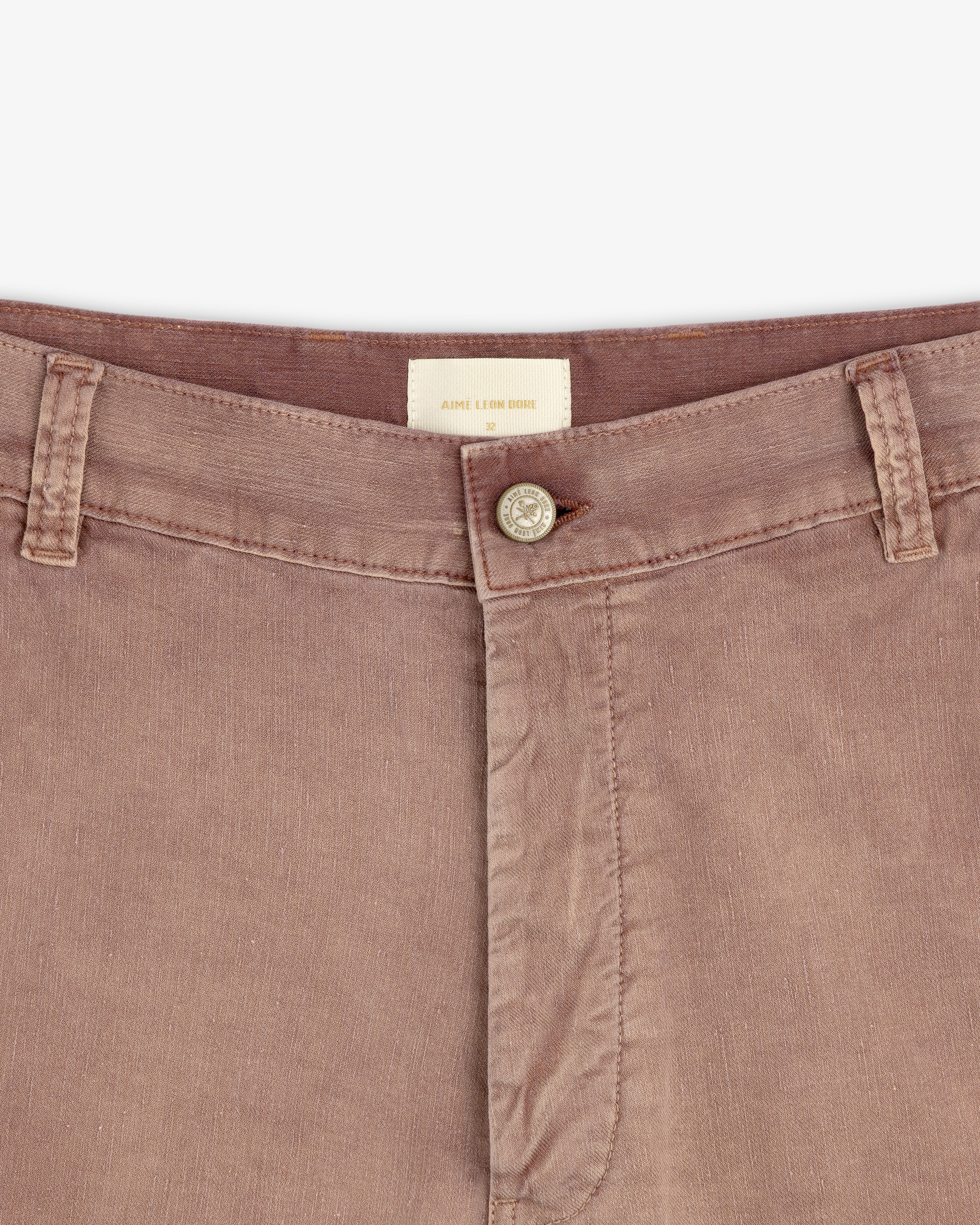 Close-up of Linen Blend Carpenter Pant waistband, featuring button closure, belt loops, and visible brand tag.