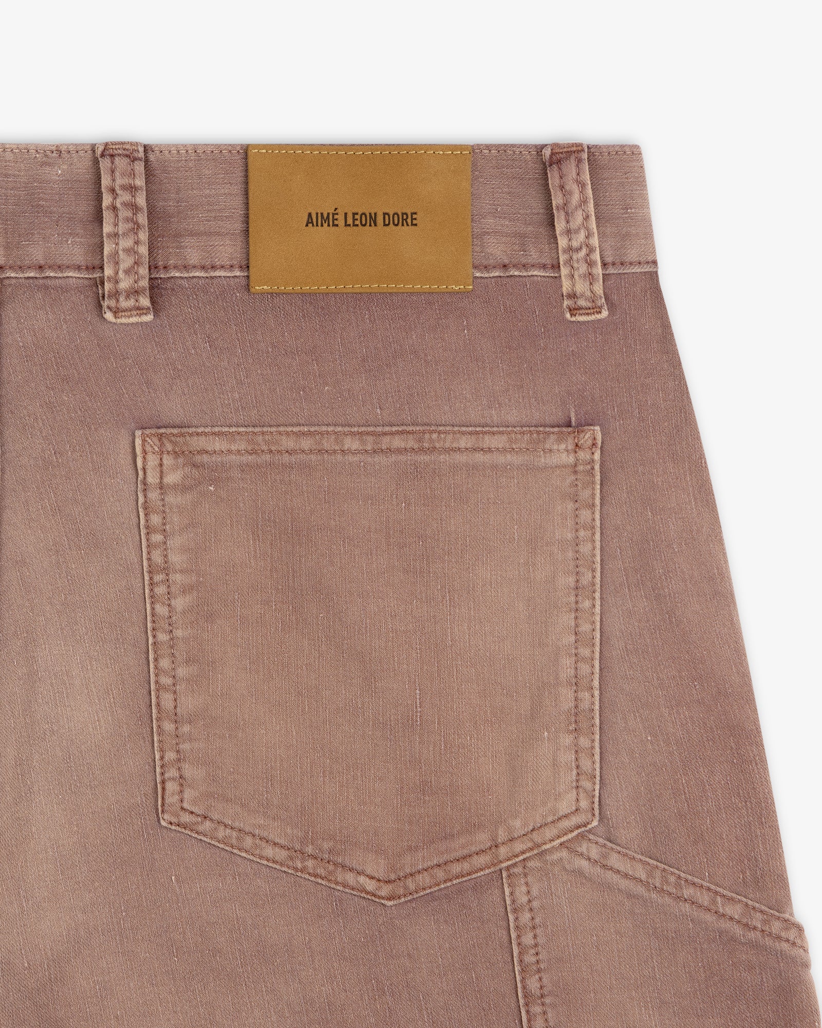 Close-up of Linen Blend Carpenter Pant in faded brown with back pocket and tan Aimé Leon Dore label on waistband.