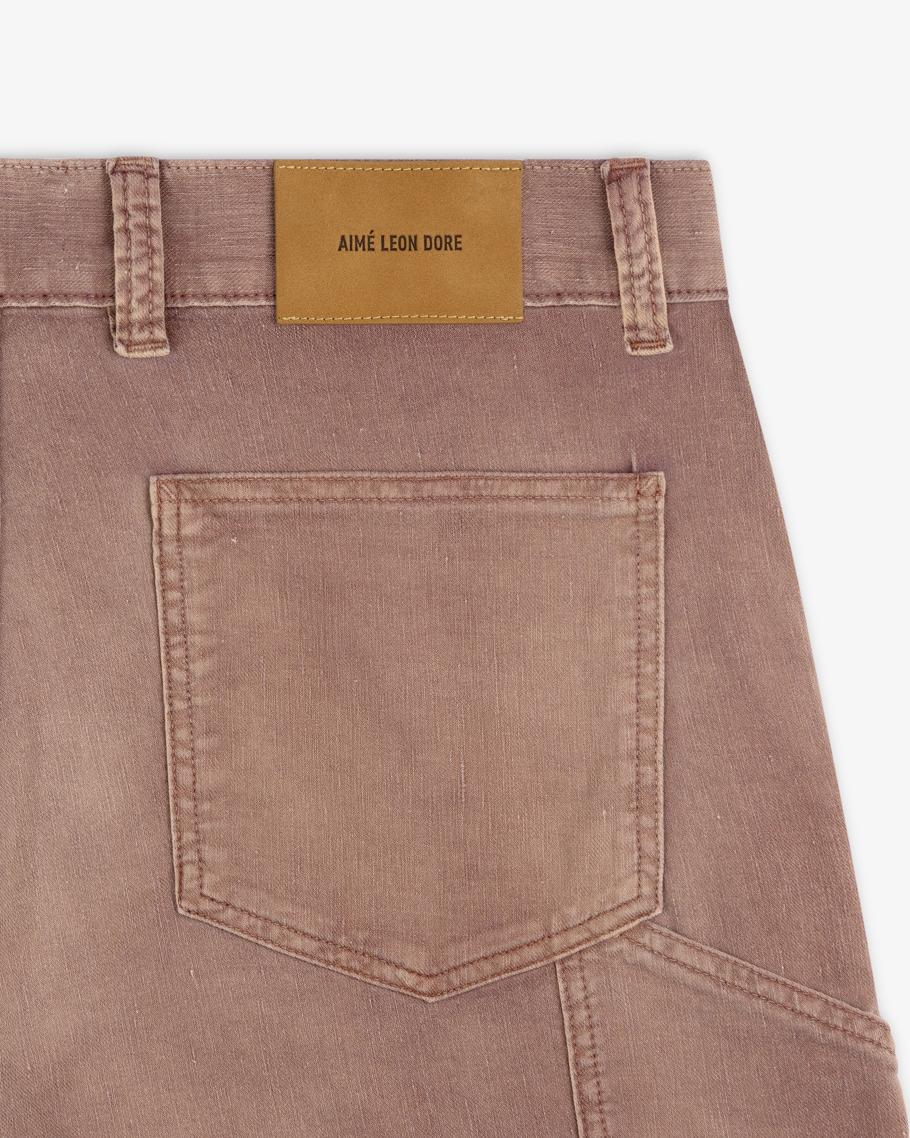 Close-up of Linen Blend Carpenter Pant in faded brown with back pocket and tan Aimé Leon Dore label on waistband.