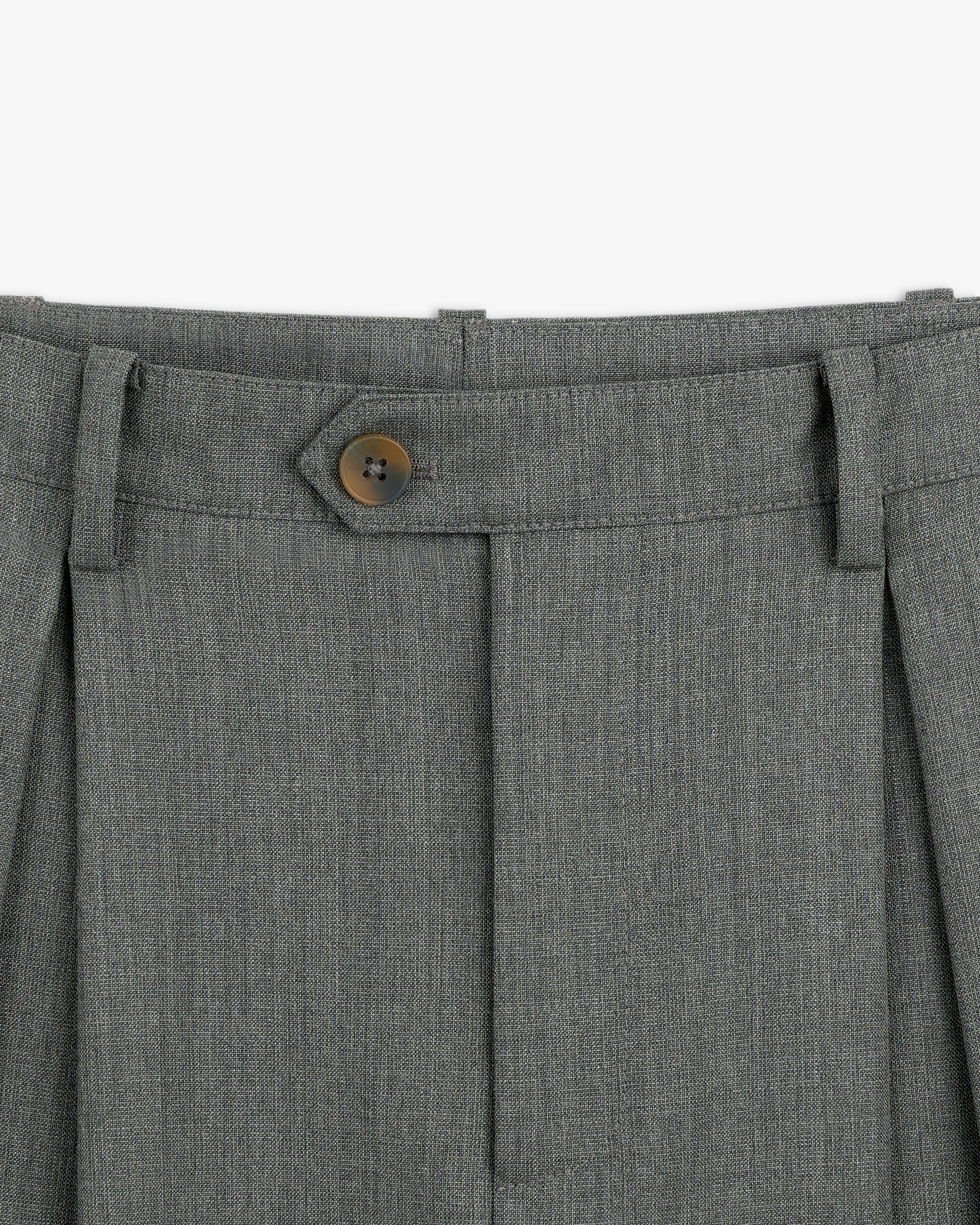 Close-up of the waistband and button on the Lightweight Cuffed Trouser with belt loops and pleats.