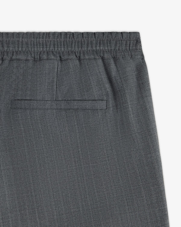 Close-up of Pinstripe Elasticated Waist Trouser featuring gray pinstripes, elastic waistband, and back welt pocket.