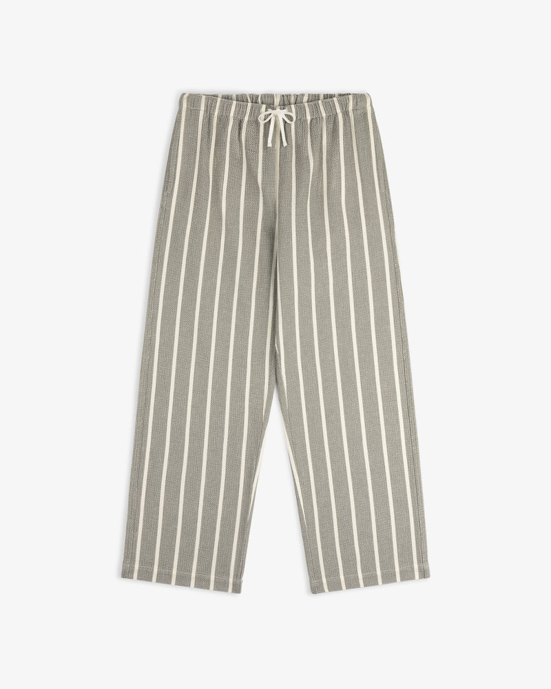 Wide Leg Shore Pant in gray and white vertical stripes with elastic waistband and drawstring, laid flat on white.