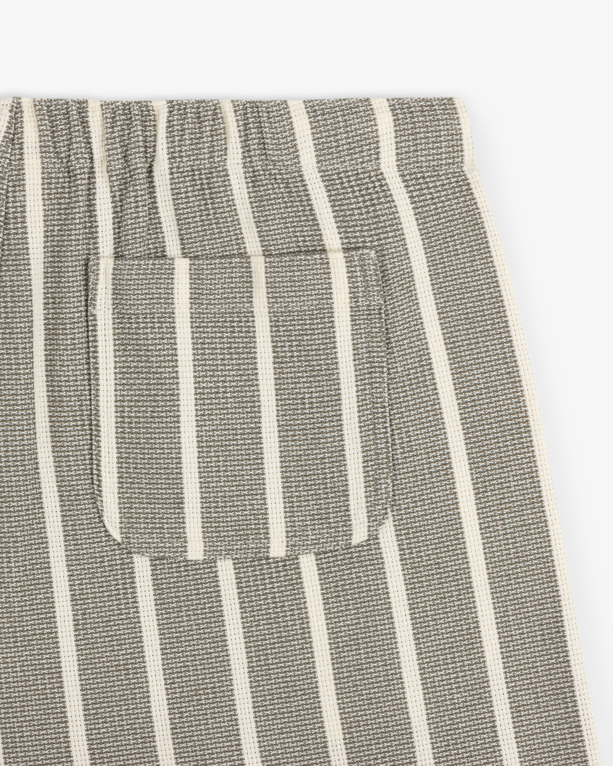 Close-up of Wide Leg Shore Pant in gray with white stripes, small patch pocket, and elastic waistband.