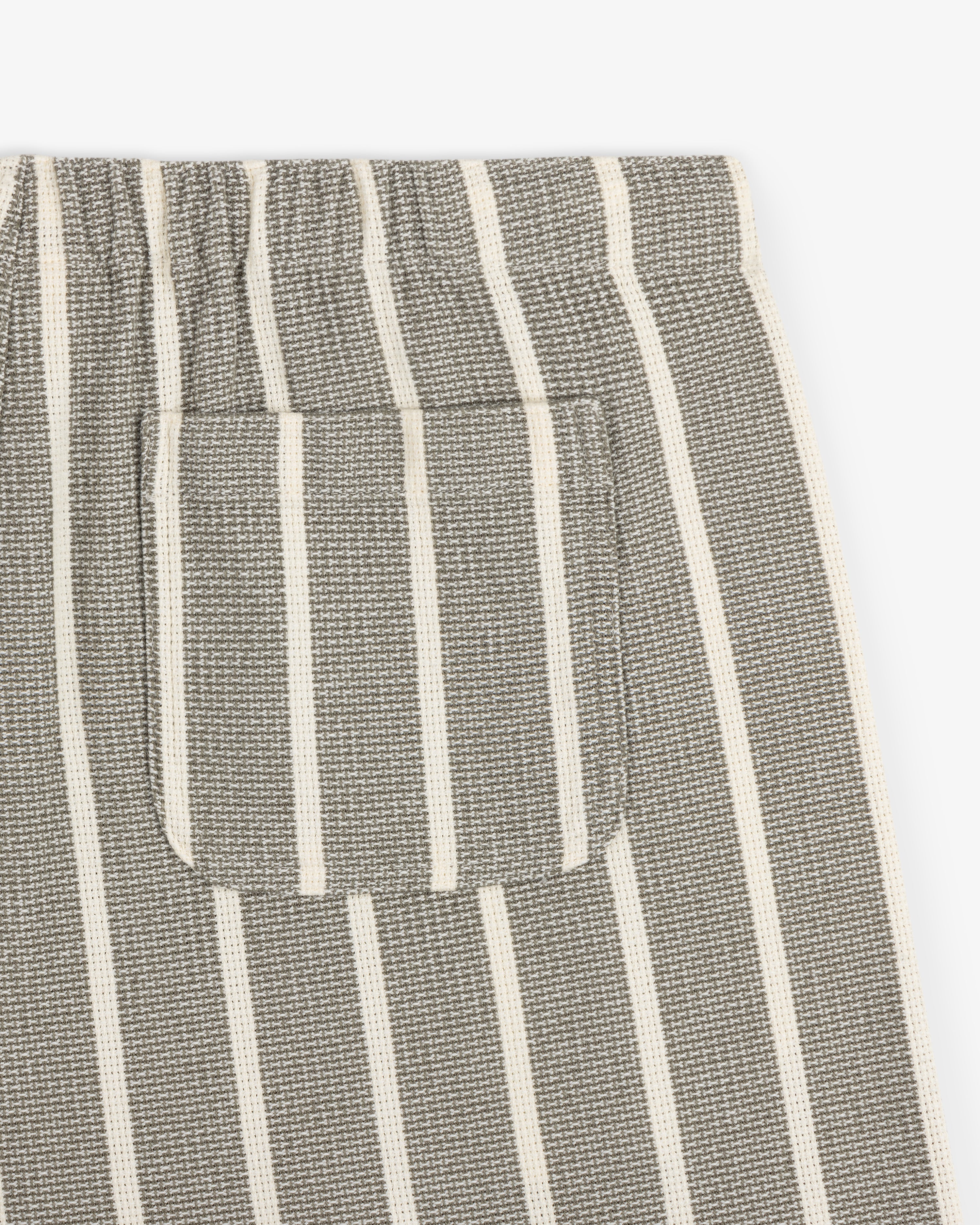 Close-up of Wide Leg Shore Pant in gray with white stripes, small patch pocket, and elastic waistband.