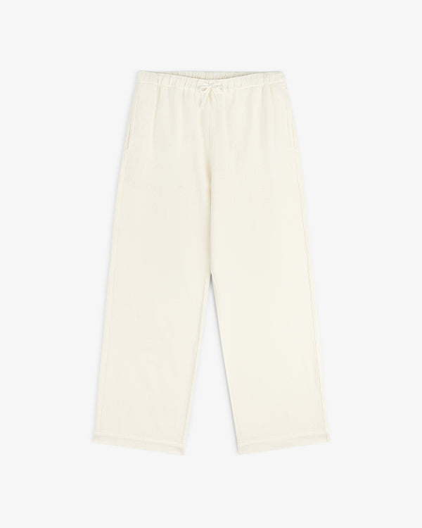 Cream-colored Wide Leg Shore Pant with an elastic waistband and side pockets, laid on a white background.