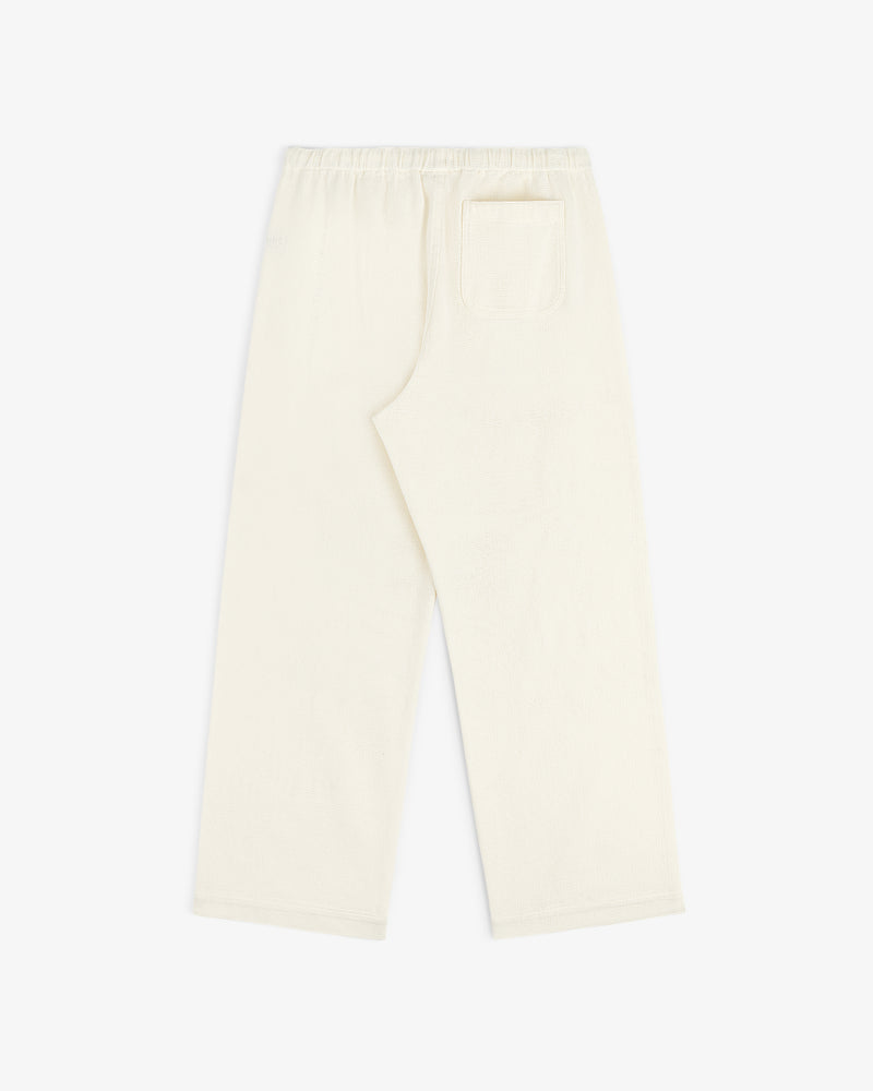 Off-white Wide Leg Shore Pant with elastic waistband and single back pocket, laid flat on a white background.