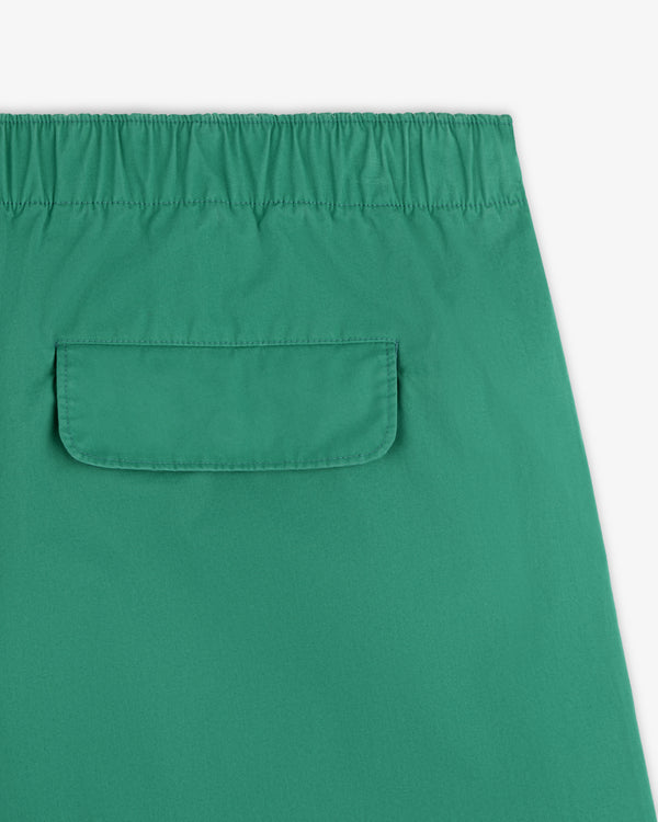 Close-up of Washed Cotton Windbreaker Pant in green with an elastic waistband and a back flap pocket.