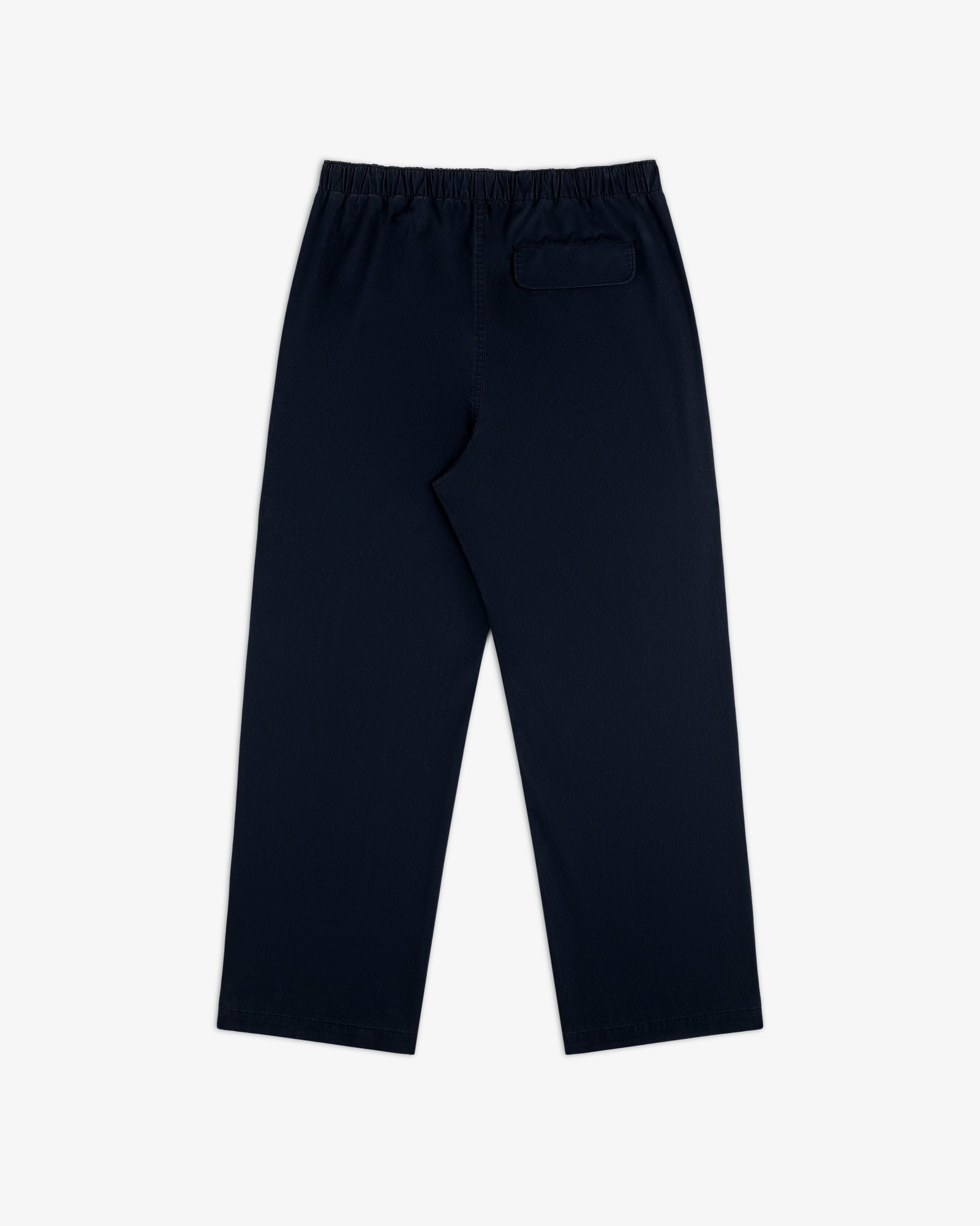 Washed Cotton Windbreaker Pant in navy blue with elastic waistband and a single back pocket, on white background.