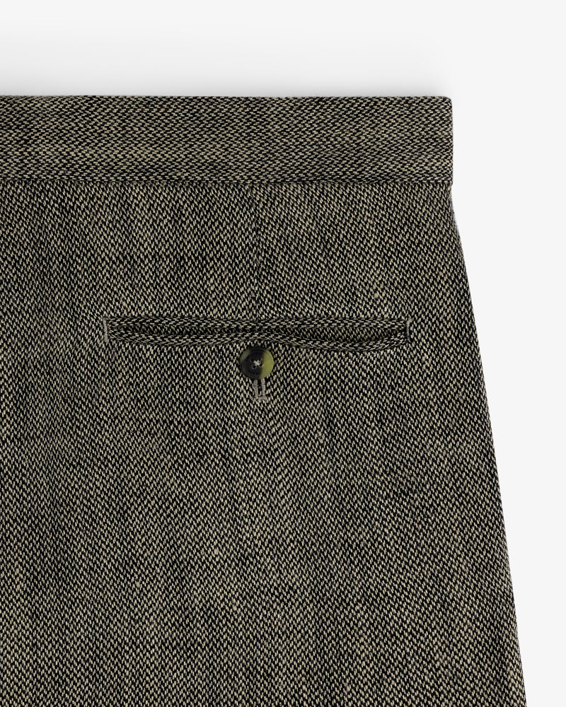 Close-up of a back pocket with a button on Yarn Dyed Linen Suit Trouser in textured brown.