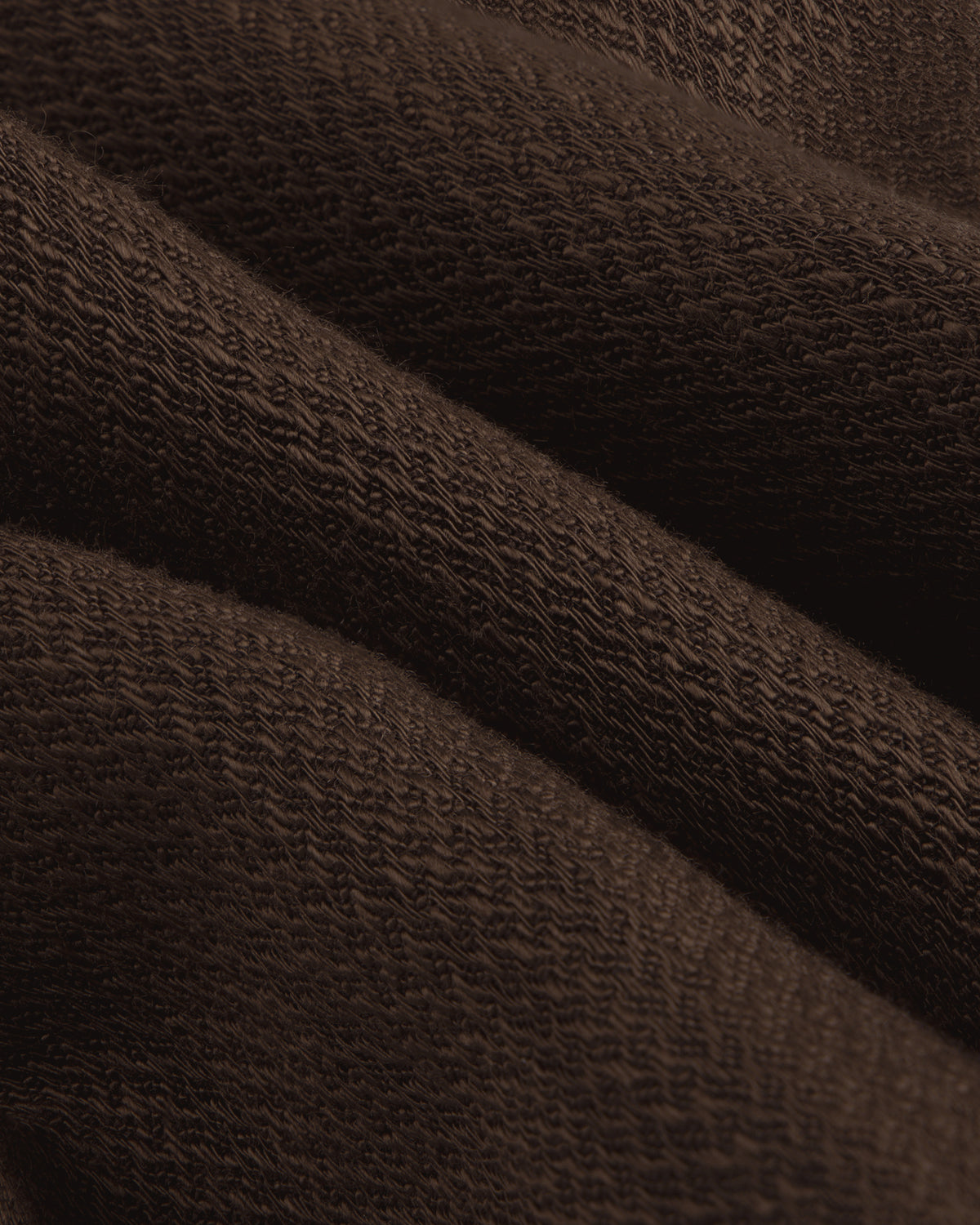 Close-up of folded Linen Blend Suit Trouser, highlighting its textured surface and weave pattern.